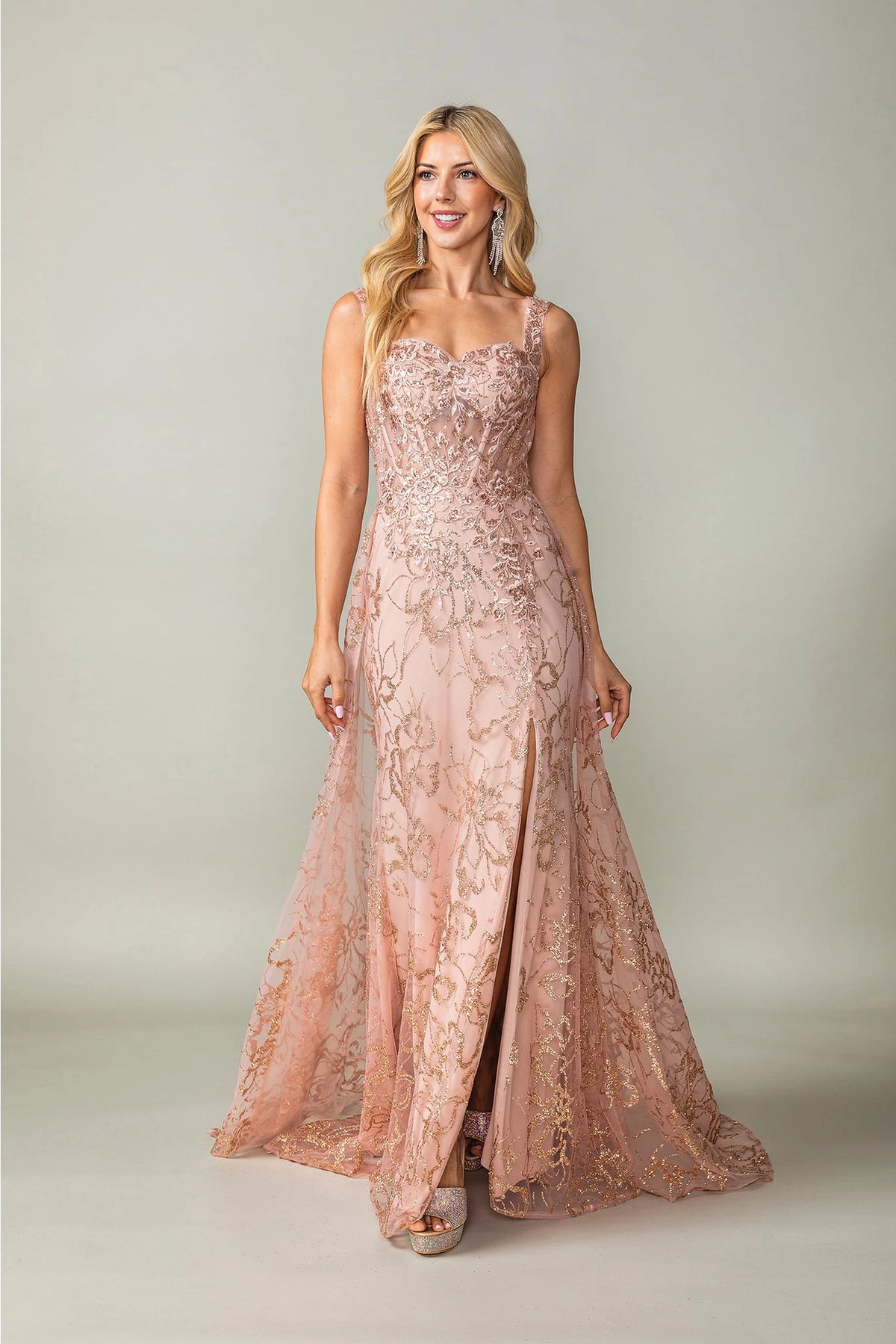 Featuring a floor-length skirt, this Rose Gold prom dress is shown in full view.