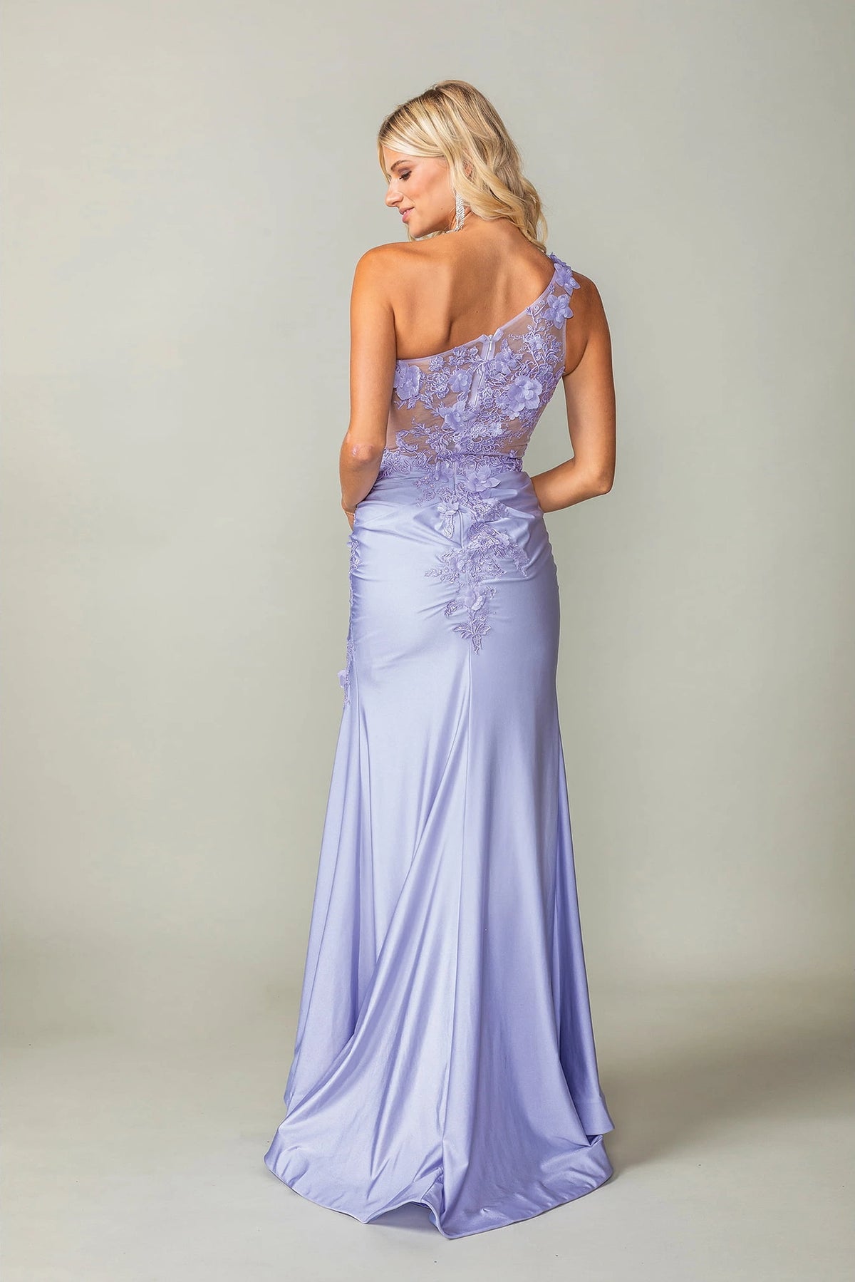 From the back, the Lilac prom dress reveals its floor-length skirt.
