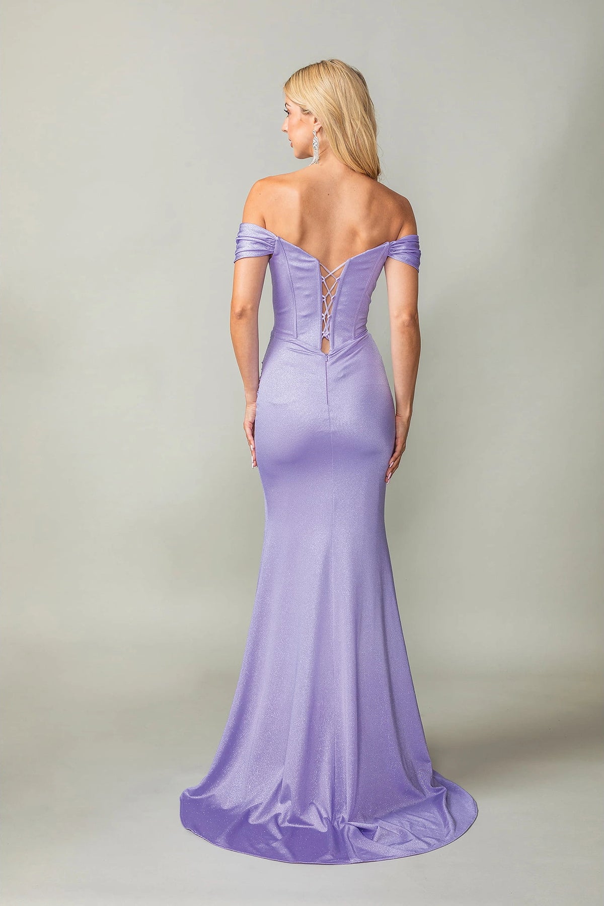 From the back, the Lilac prom dress reveals its floor-length skirt.