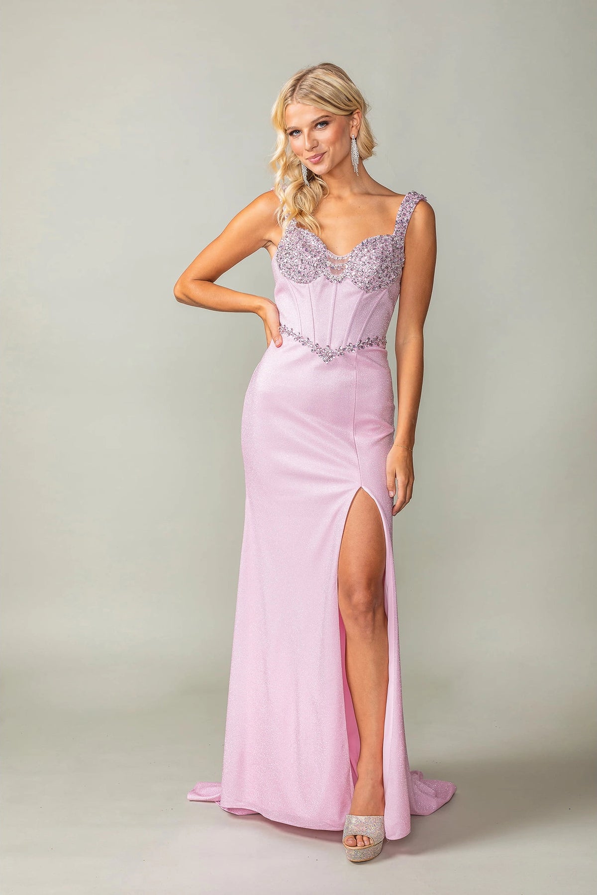 Featuring a floor-length skirt, this Pink prom dress is shown in full view.