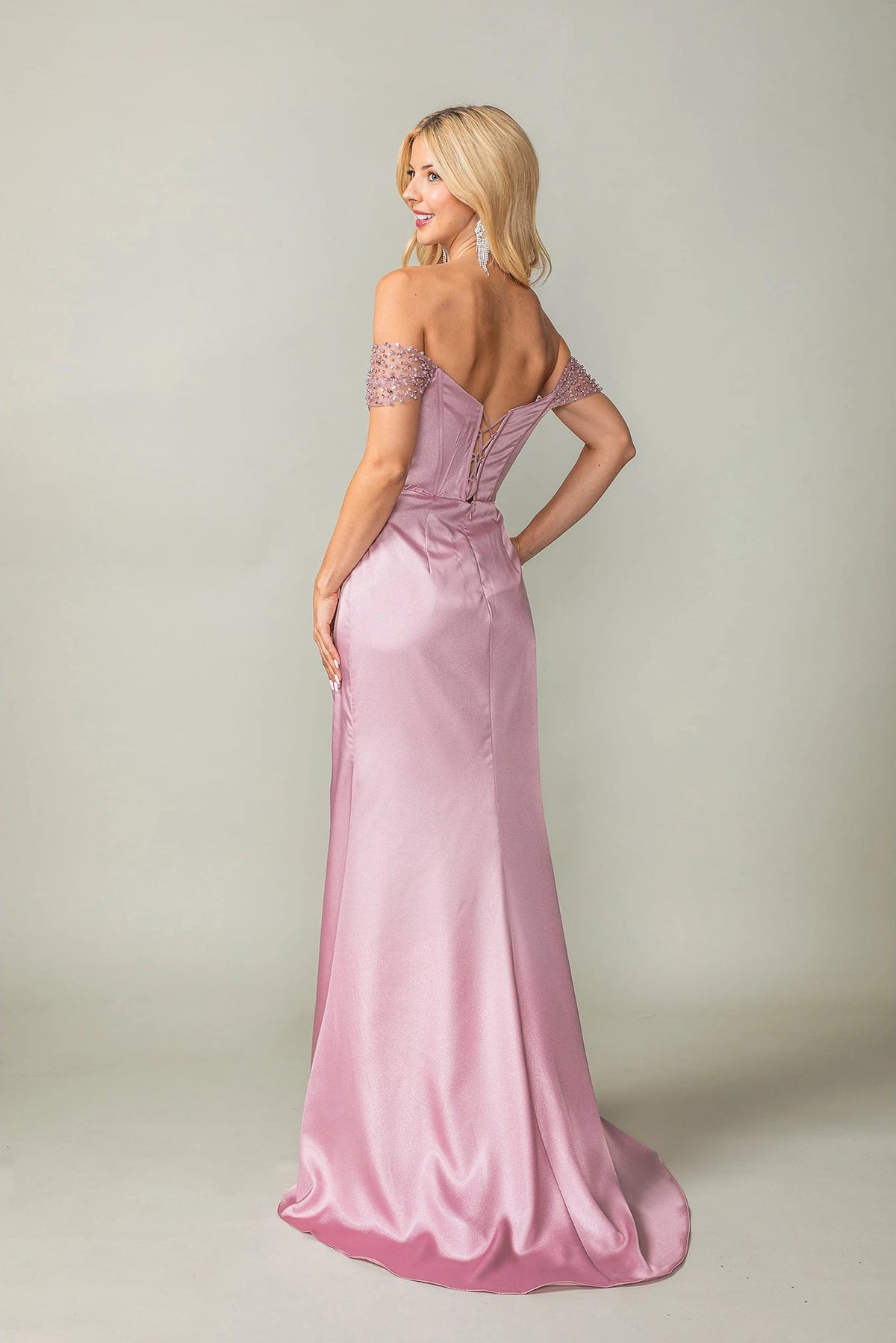 From the back, the Dusty Rose prom dress reveals its floor-length skirt.