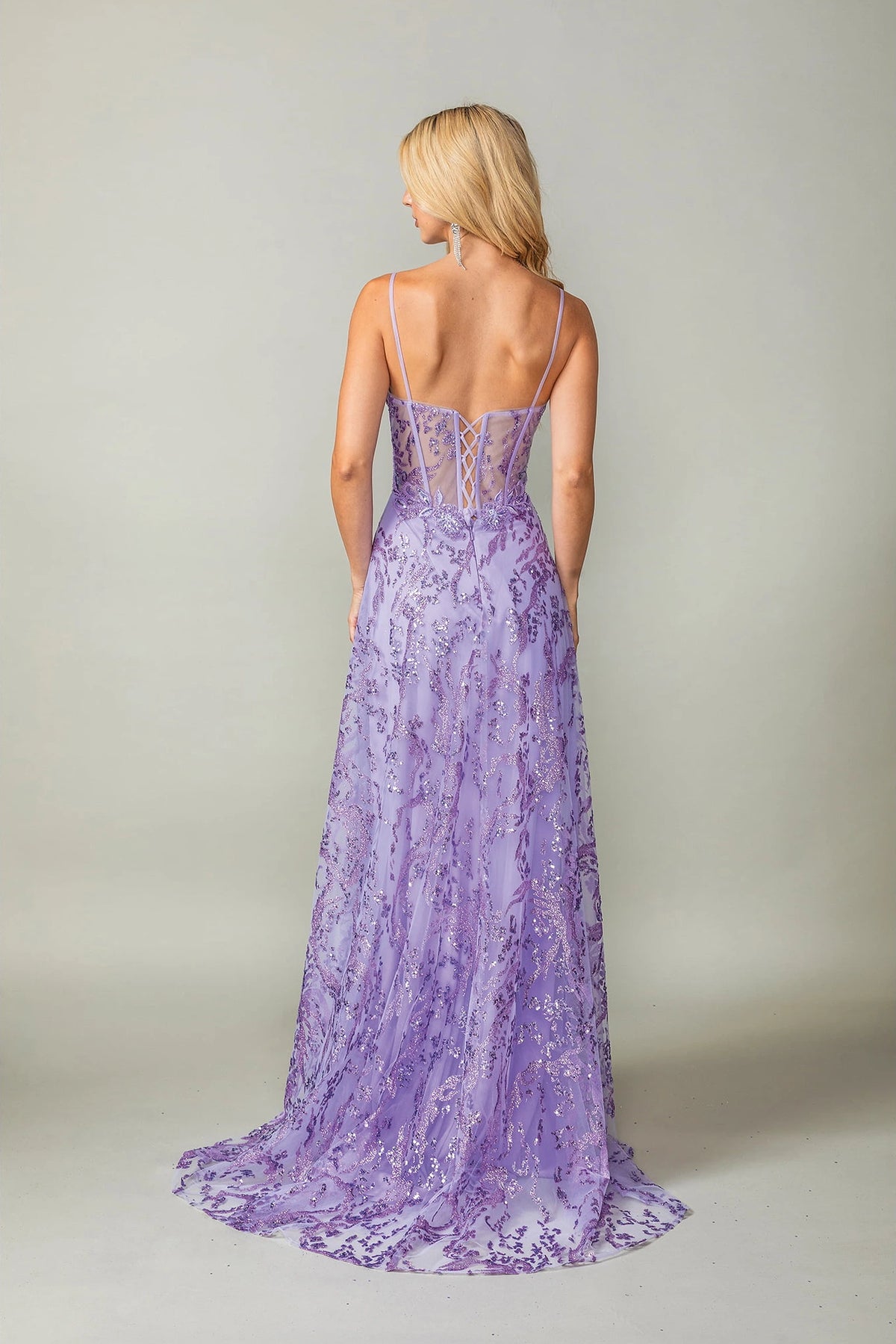 From the back, the Lilac prom dress reveals its floor-length skirt.