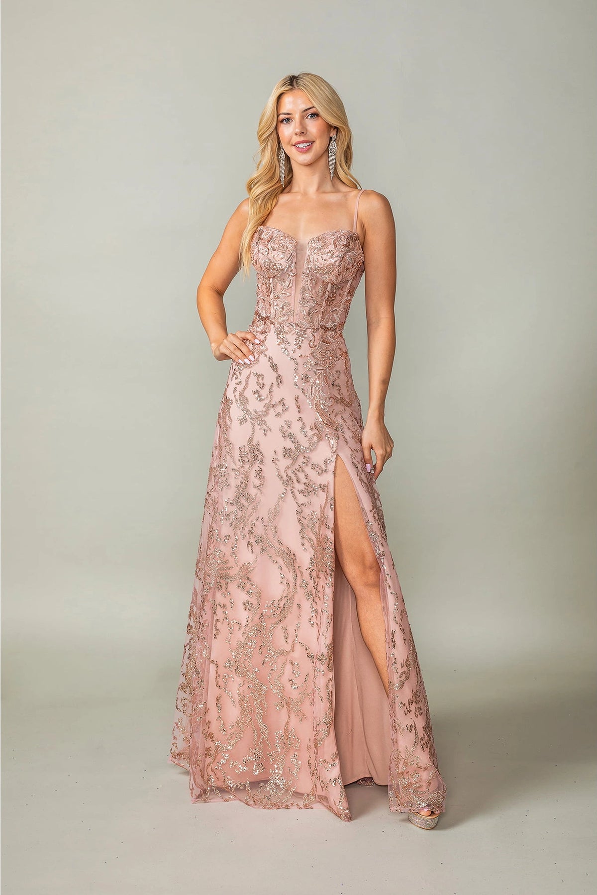 Featuring a floor-length skirt, this Rose Gold prom dress is shown in full view.