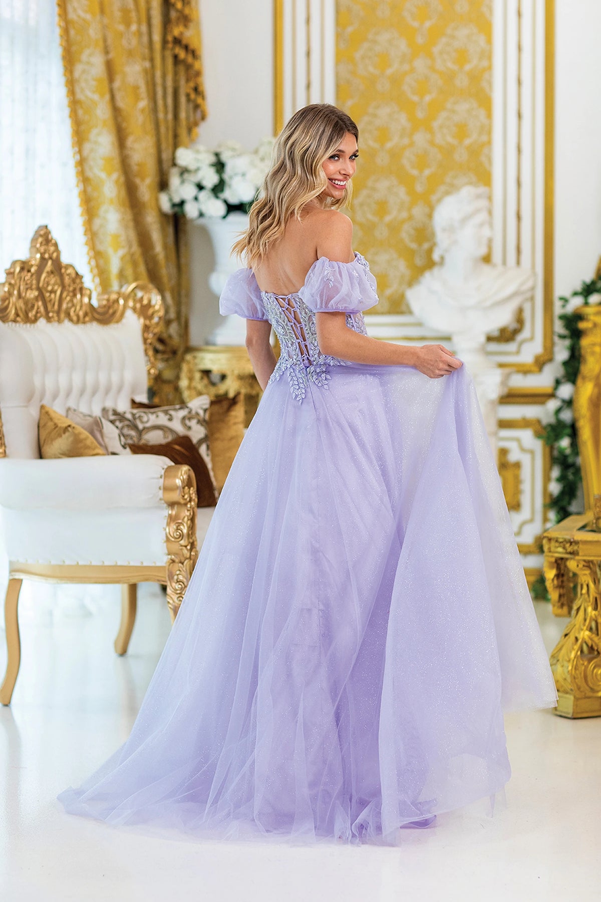 From the back, the Lilac prom dress reveals its floor-length skirt.