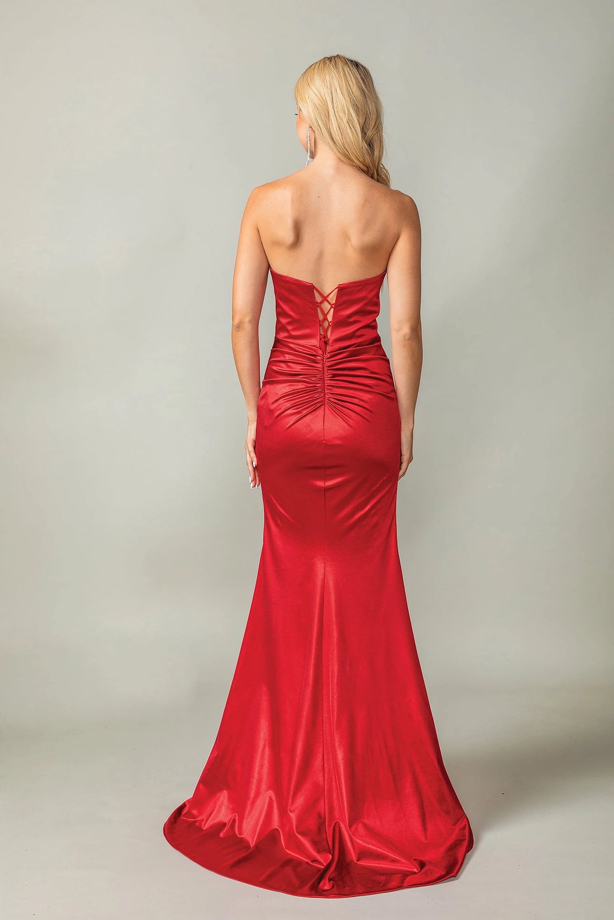 From the back, the Red prom dress reveals its floor-length skirt.