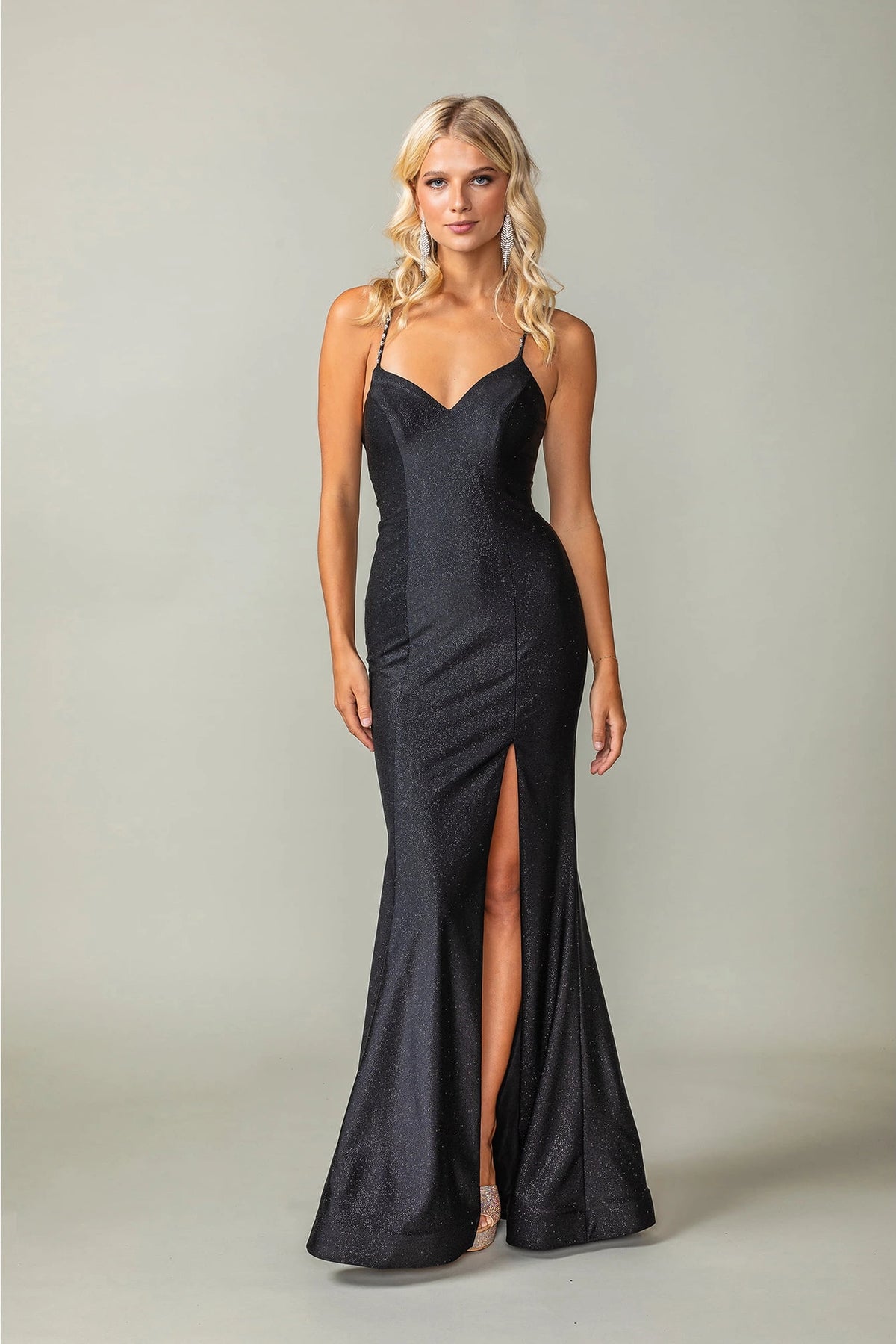 Featuring a floor-length skirt, this Black prom dress is shown in full view.