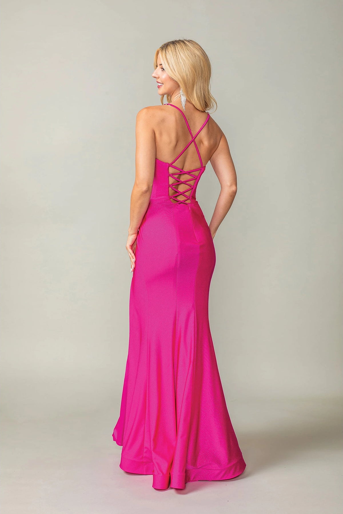 From the back, the Fuchsia prom dress reveals its floor-length skirt.