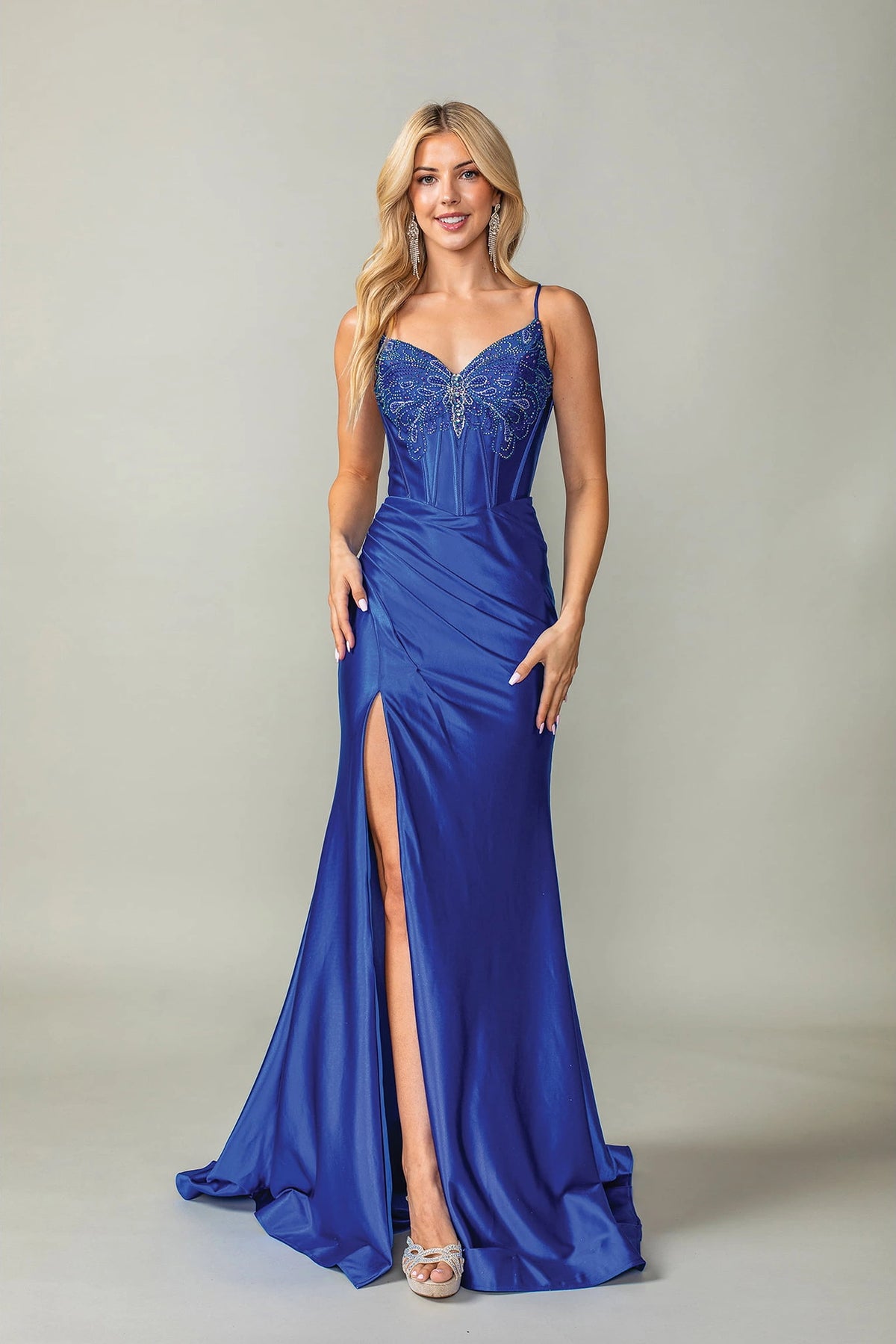 Featuring a floor-length skirt, this Royal Blue prom dress is shown in full view.