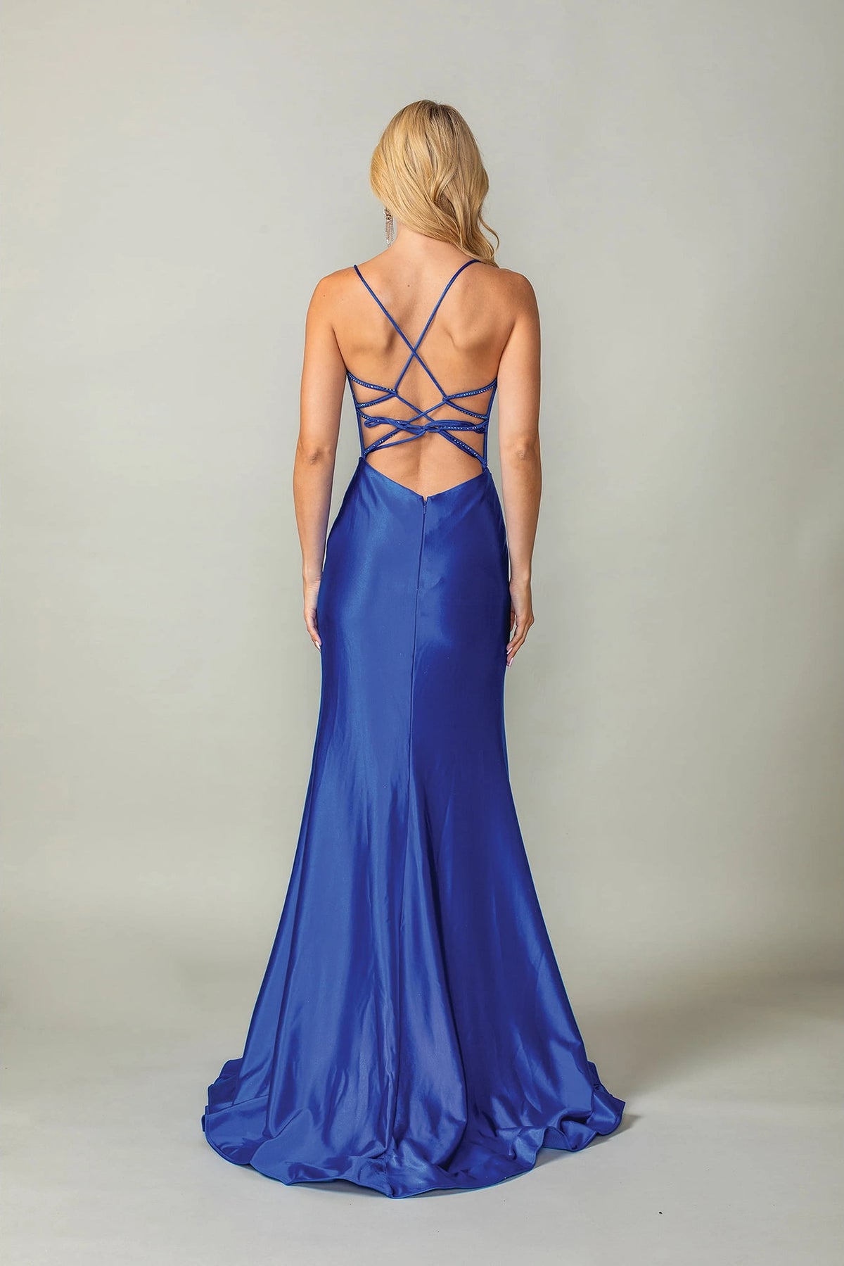 From the back, the Royal Blue prom dress reveals its floor-length skirt.