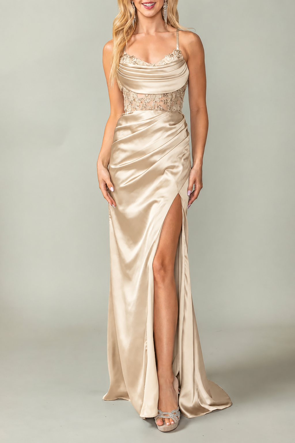 Draped neckline and thigh-high slit define the Champagne Beaded Prom Dress.