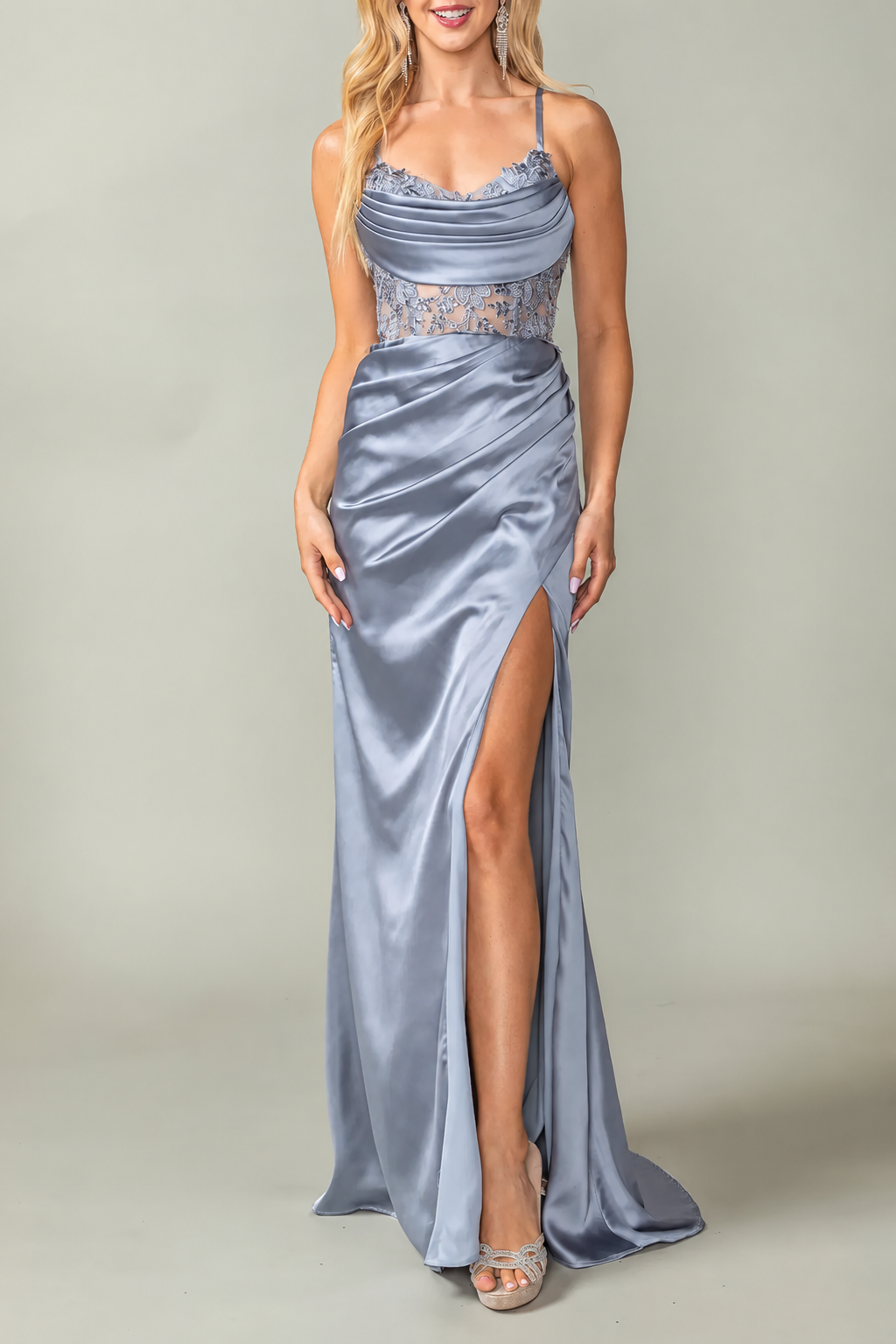Draped neckline and thigh-high slit define the Silver Beaded Prom Dress.
