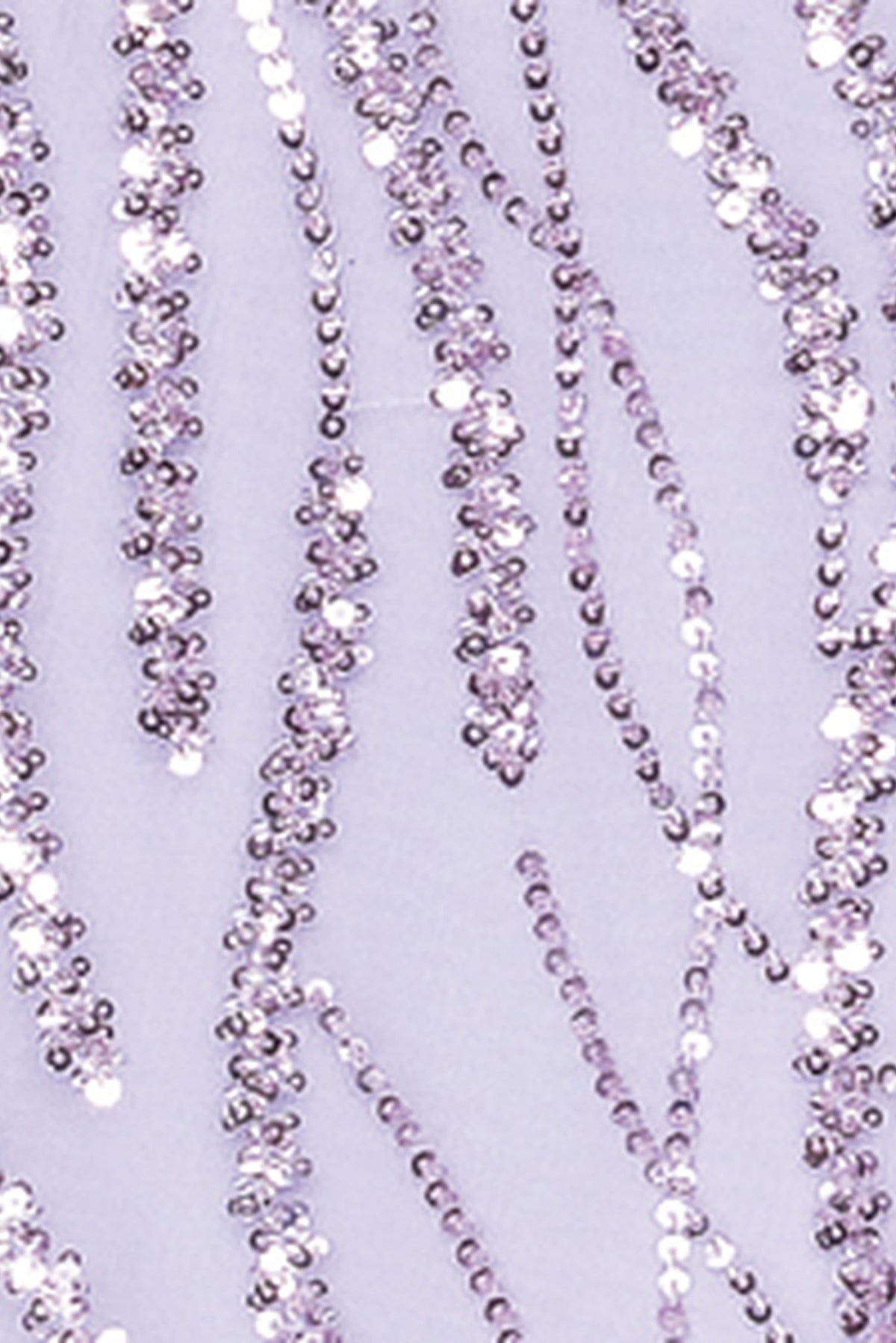 Featuring textured embellishments, this Lilac prom dress is shown in detail.