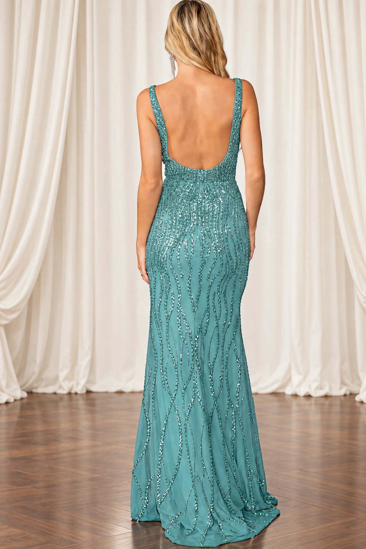 sage green sequined evening gown with a deep open back