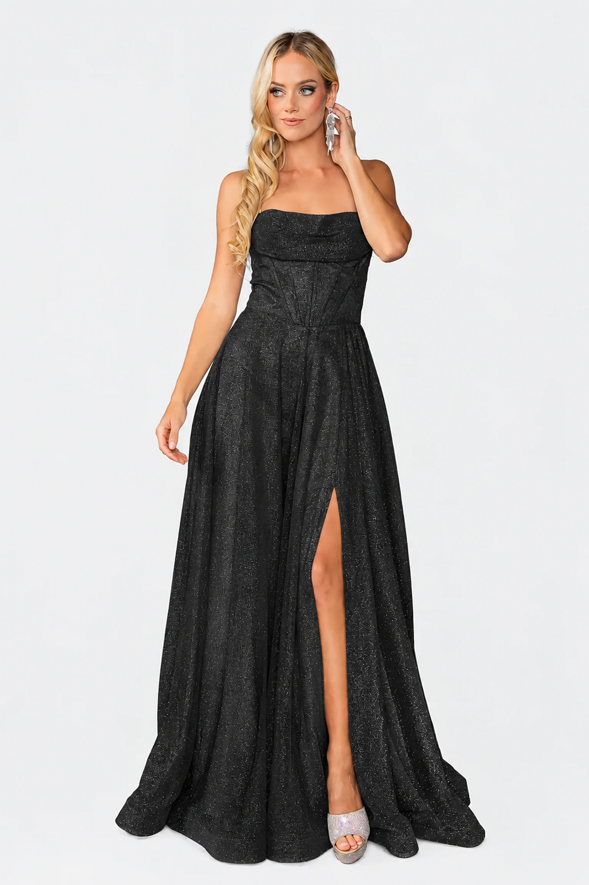 Straight neckline and thigh-high slit define the Black Shimmering Prom Dress.