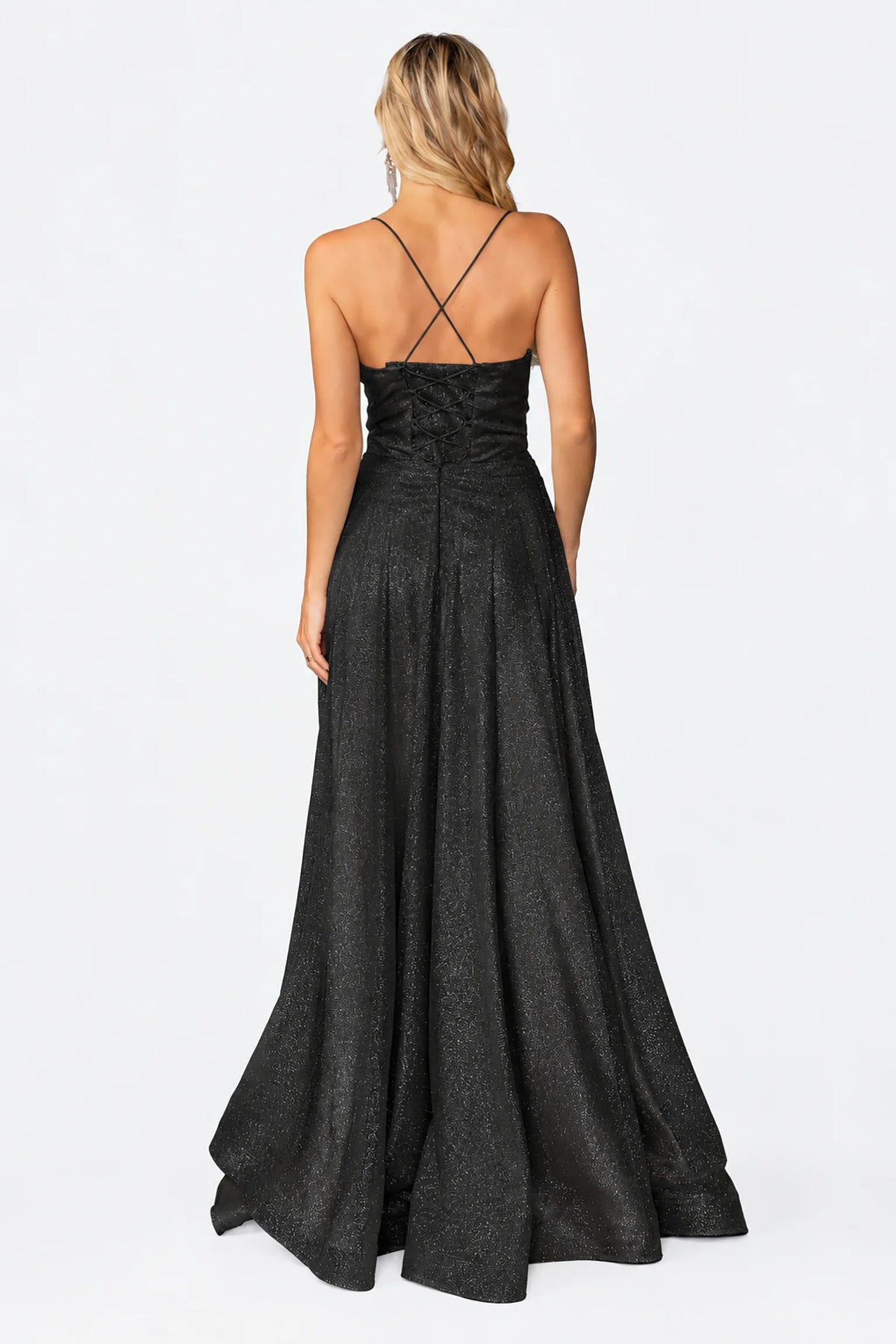 Crossed straps and flowing skirt complete the Black Shimmering Prom Dress.