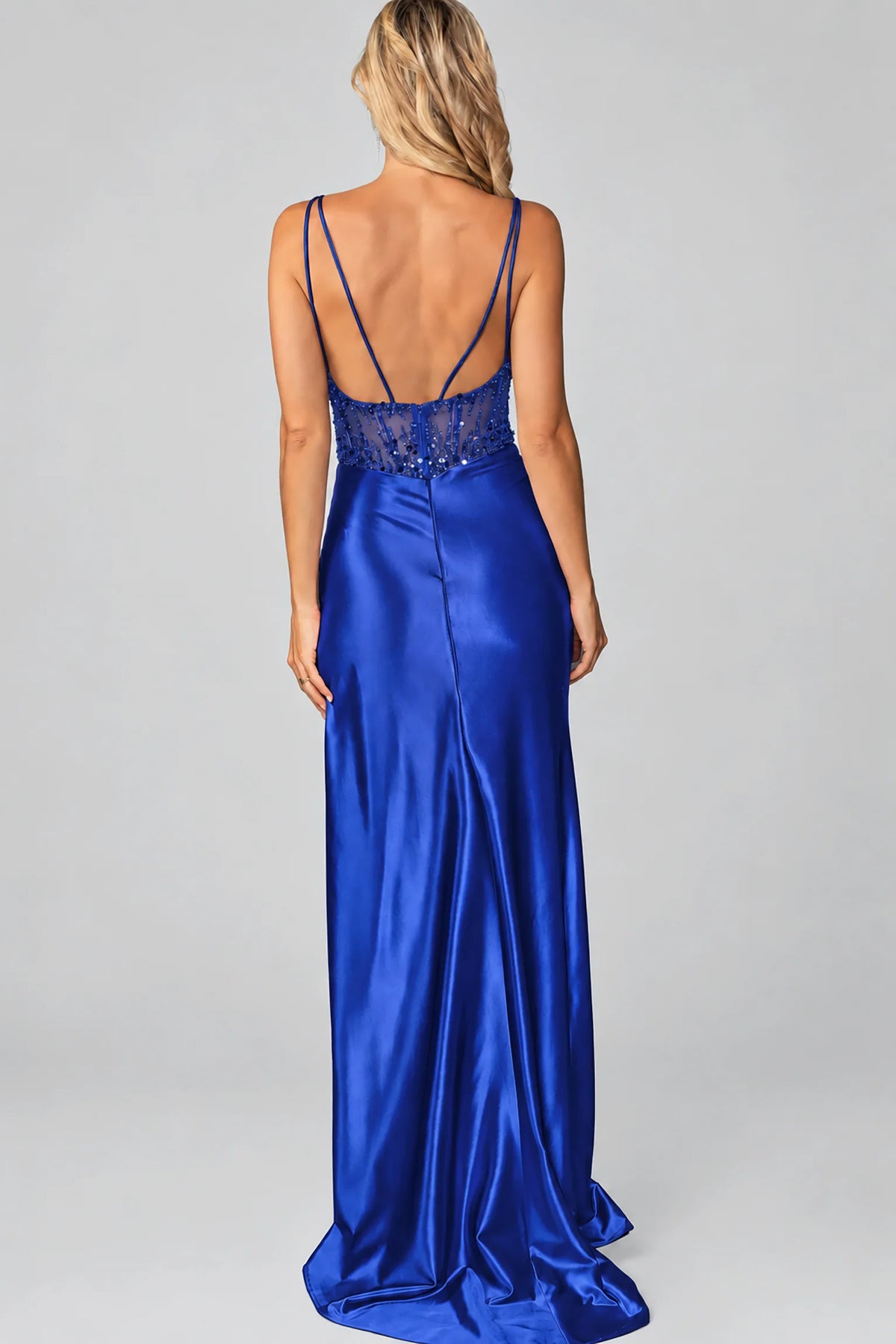 a royal blue satin maxi dress with a lace-up open back and beaded waistband
