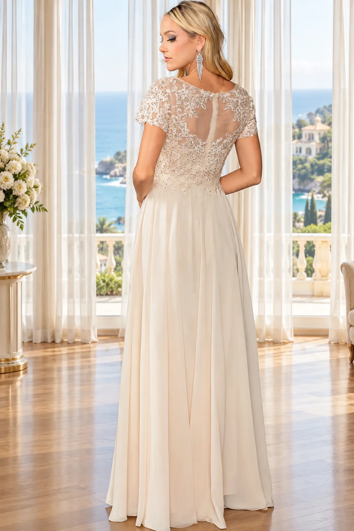 champagne evening gown with lace cap sleeves, a sheer lace back, and a flowing chiffon skirt. 