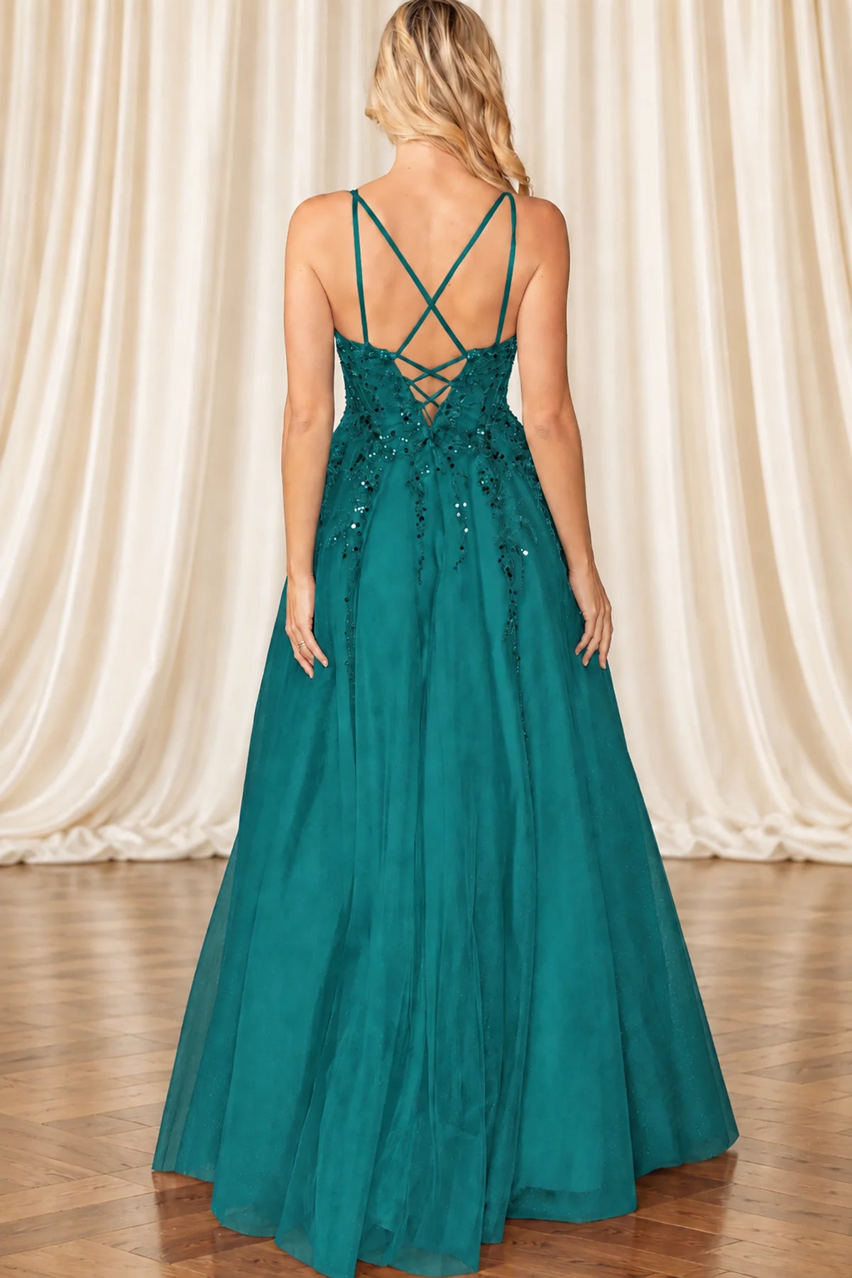 Lace-up back and flowing skirt complete the Hunter Green Beaded Prom Dress.