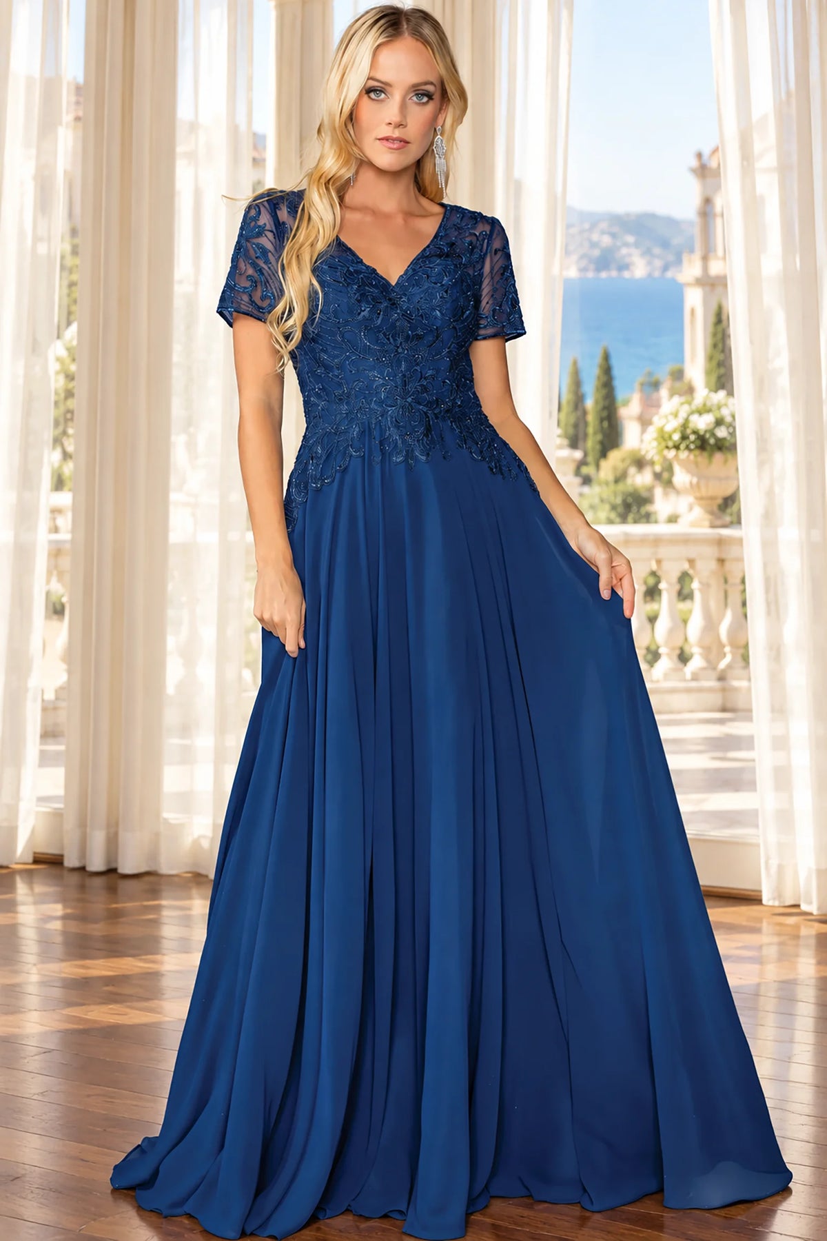 loor-length navy evening gown with a lace bodice, short sleeves, and a flowing chiffon skirt