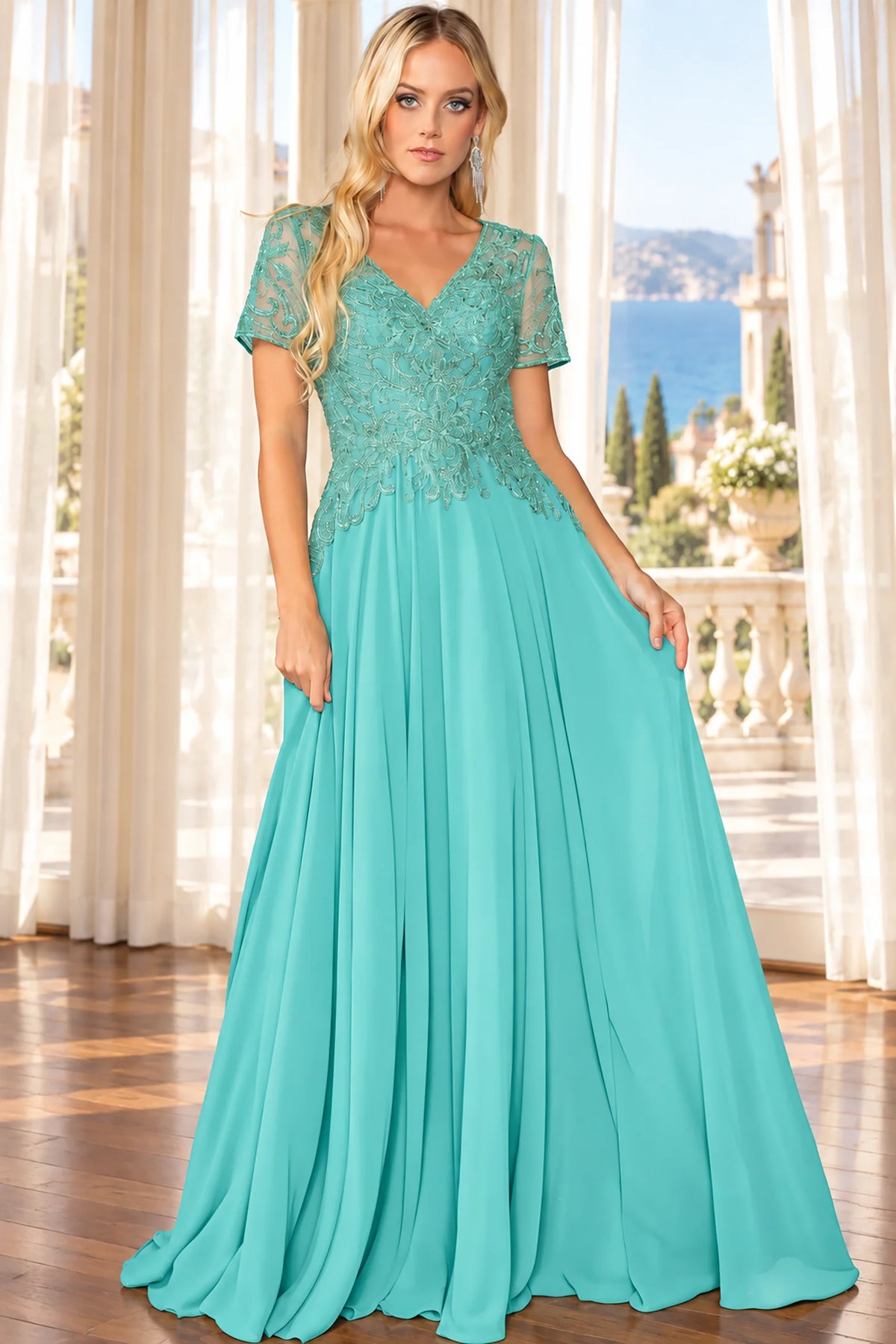  floor-length sage turquoise gown with a lace bodice, sheer short sleeves, and a flowing chiffon skirt
