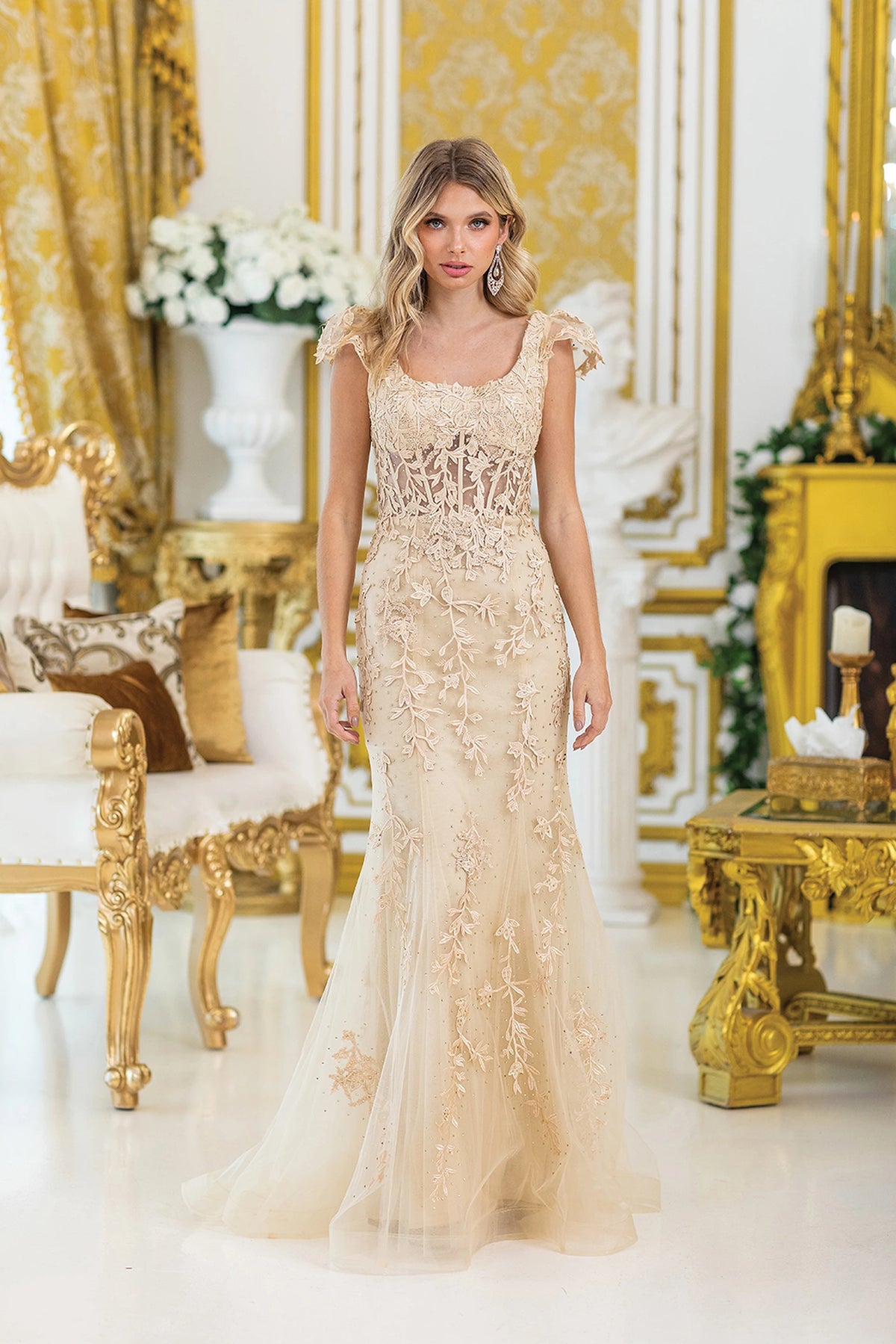 Featuring a floor-length skirt, this Champagne prom dress is shown in full view.