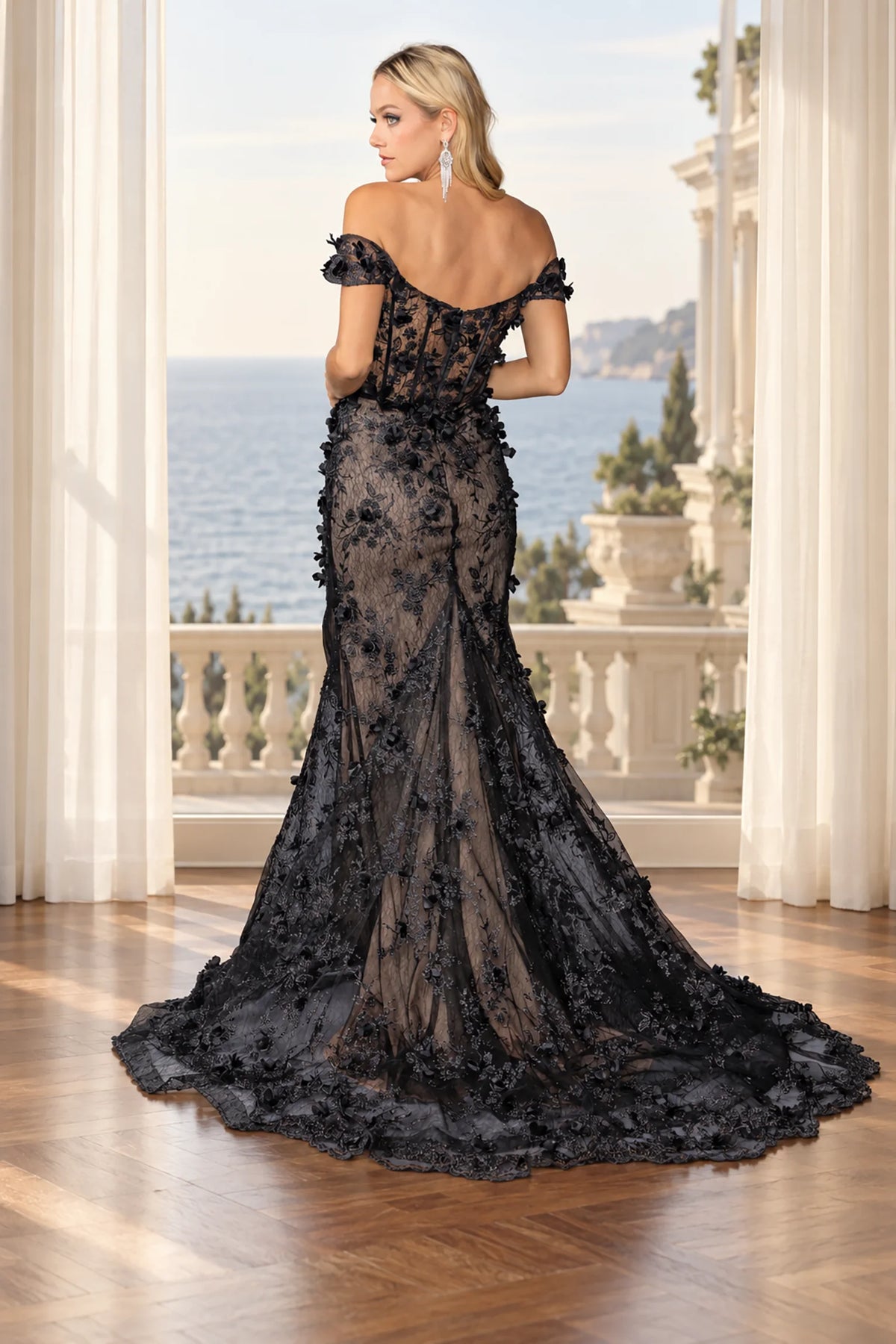 black off-the-shoulder evening gown with a dramatic train and floral lace detailing.