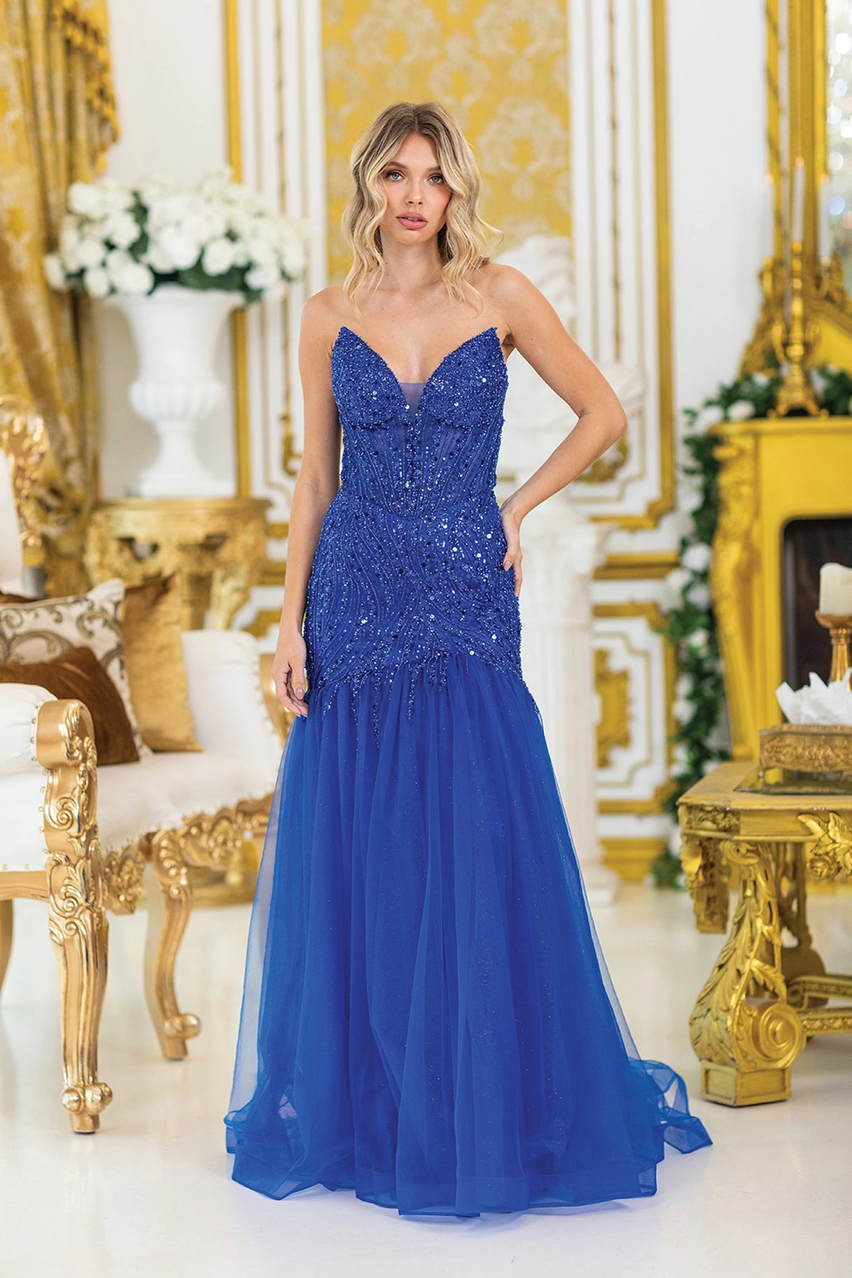 Featuring a floor-length skirt, this Royal Blue prom dress is shown in full view.