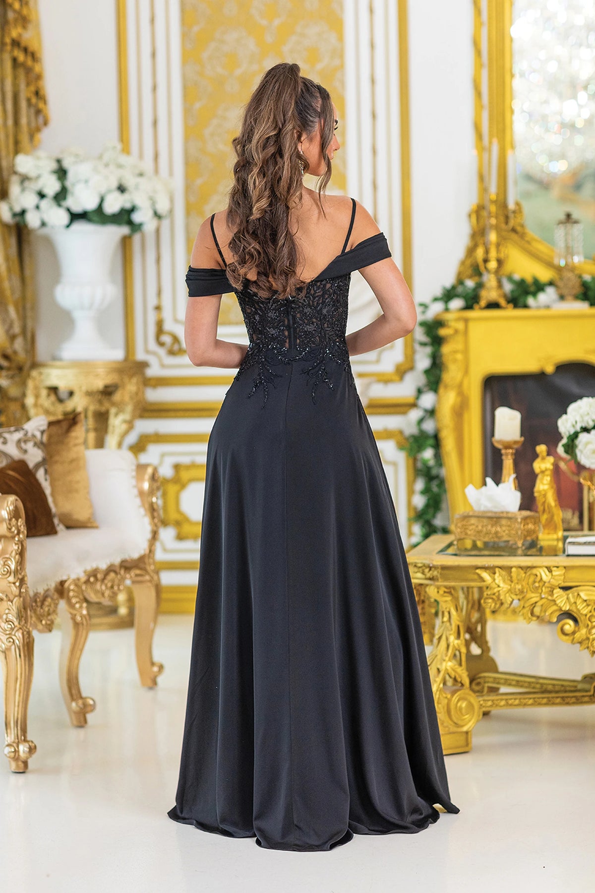 From the back, the Black prom dress reveals its floor-length skirt.