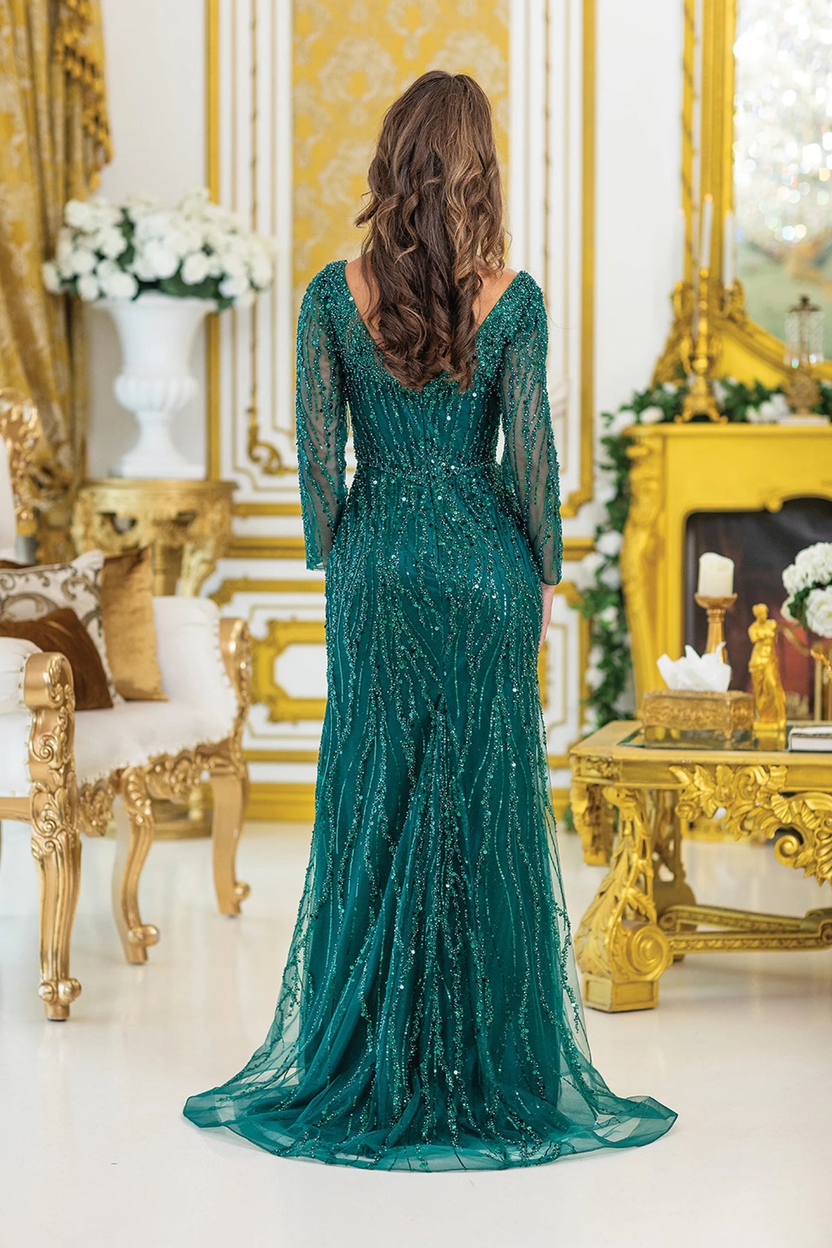 From the back, the Hunter Green prom dress reveals its floor-length skirt.