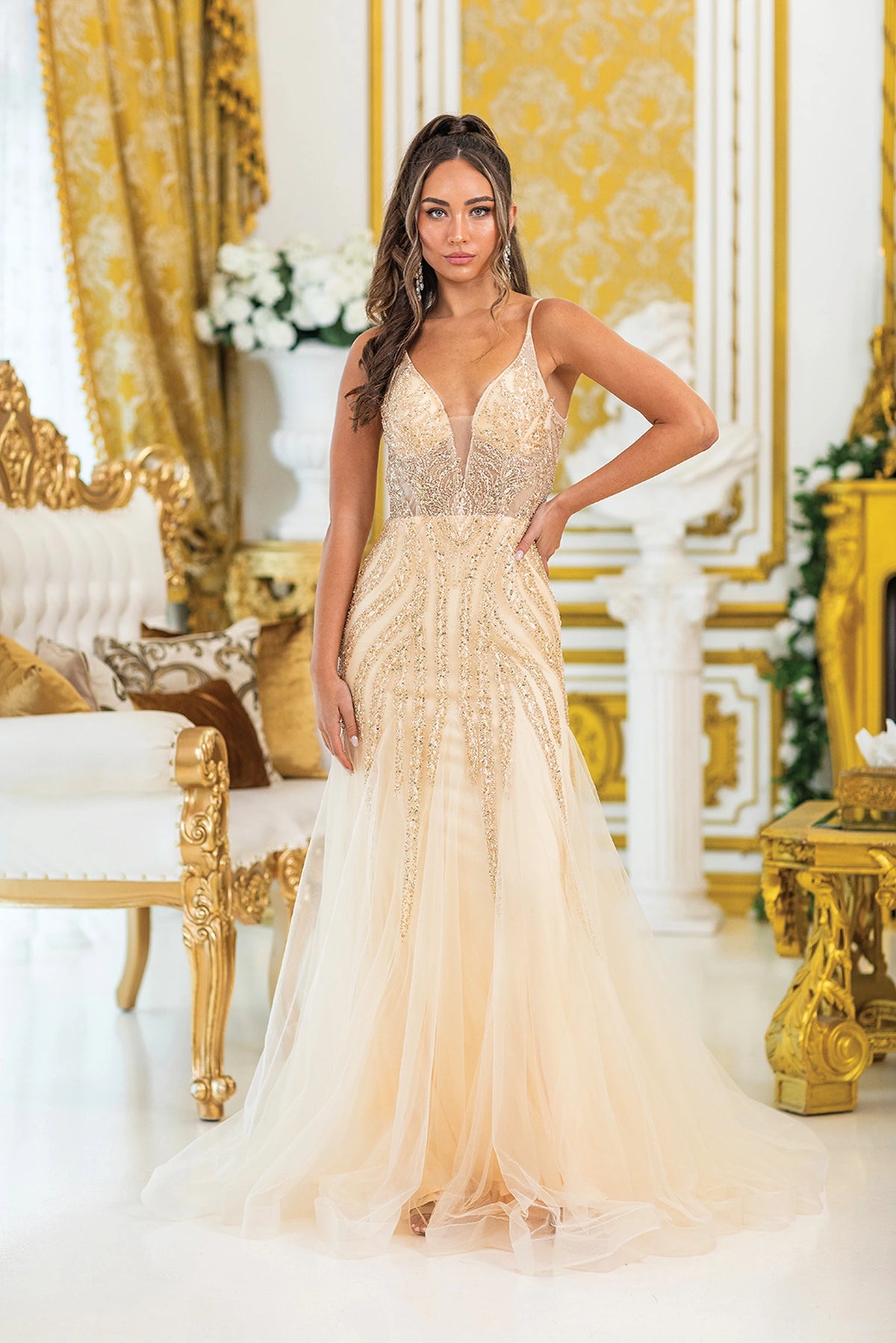 Featuring a floor-length skirt, this Champagne prom dress is shown in full view.
