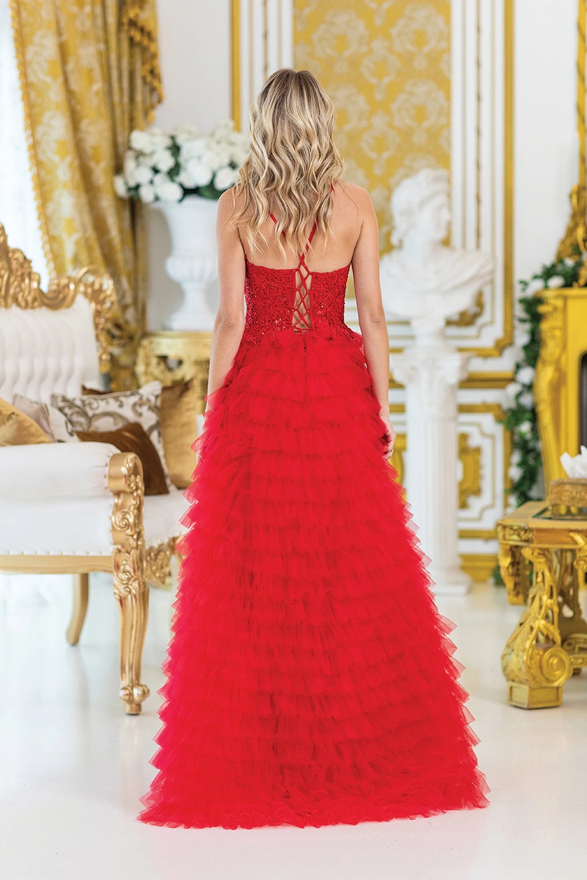 From the back, the Red prom dress reveals its floor-length skirt.