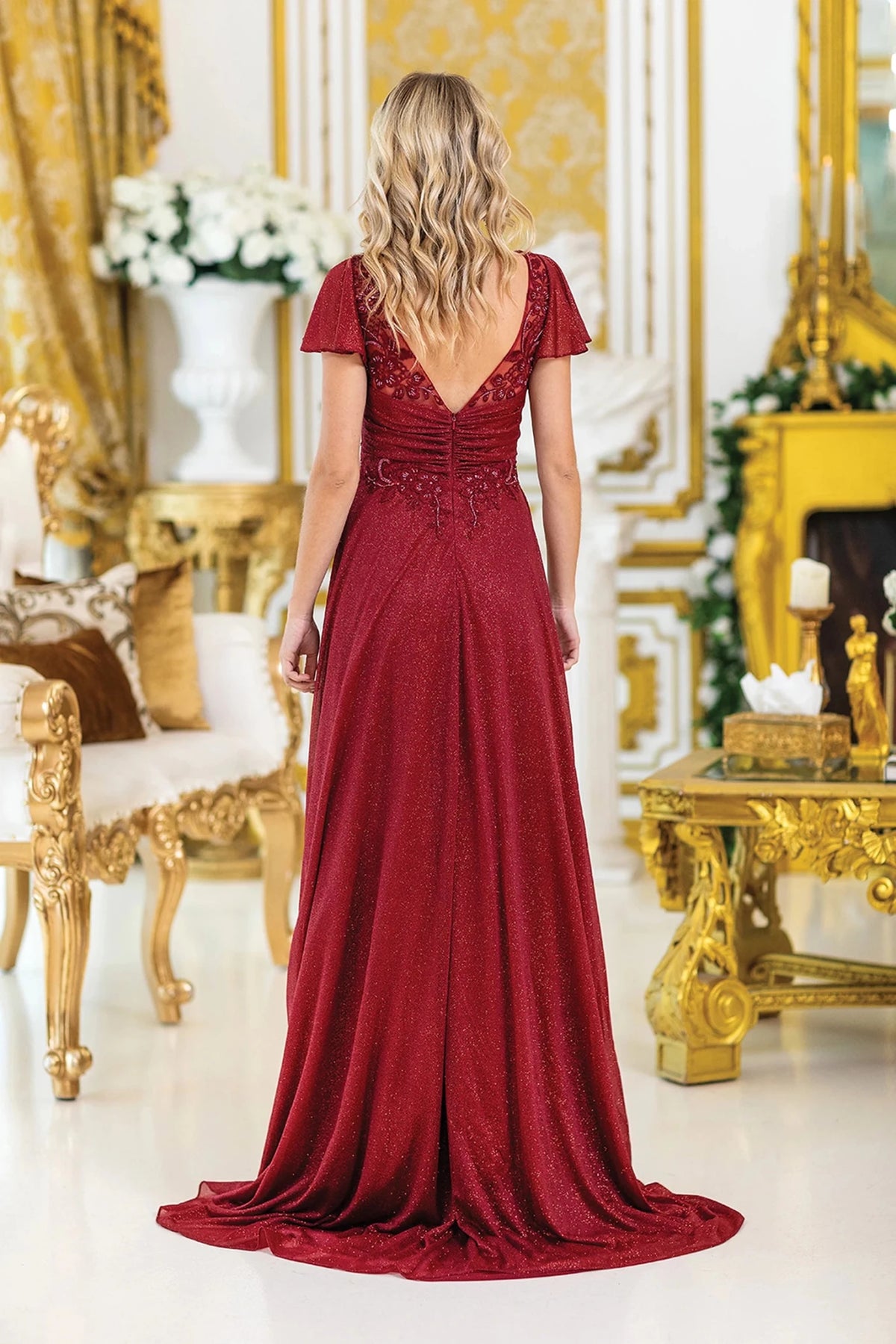 From the back, the Burgundy prom dress reveals its floor-length skirt.