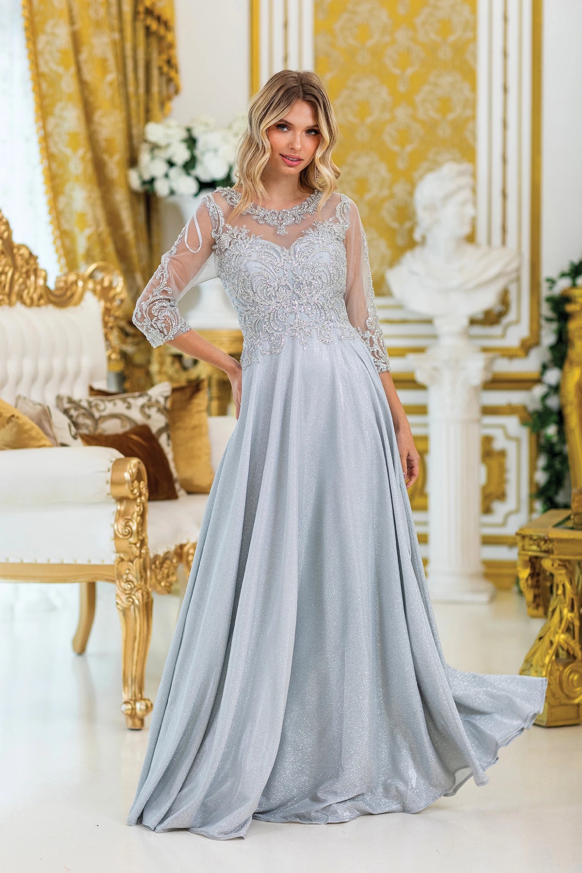 Featuring a floor-length skirt, this Silver prom dress is shown in full view.