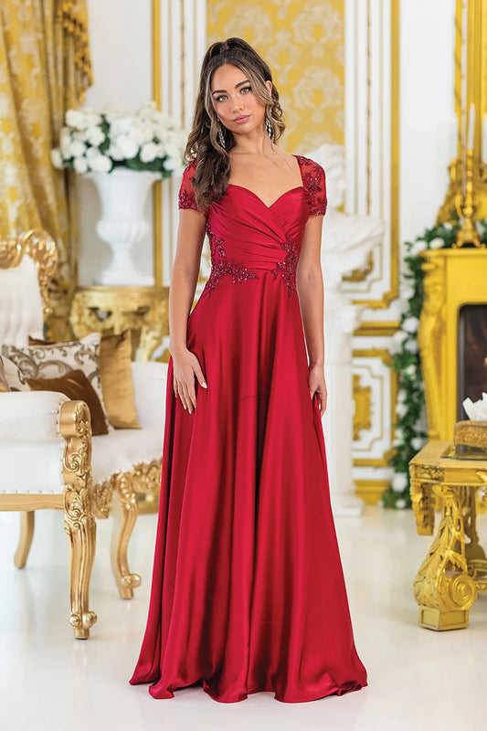Woman in Burgundy A-line prom dress with floral lace and short sleeves.