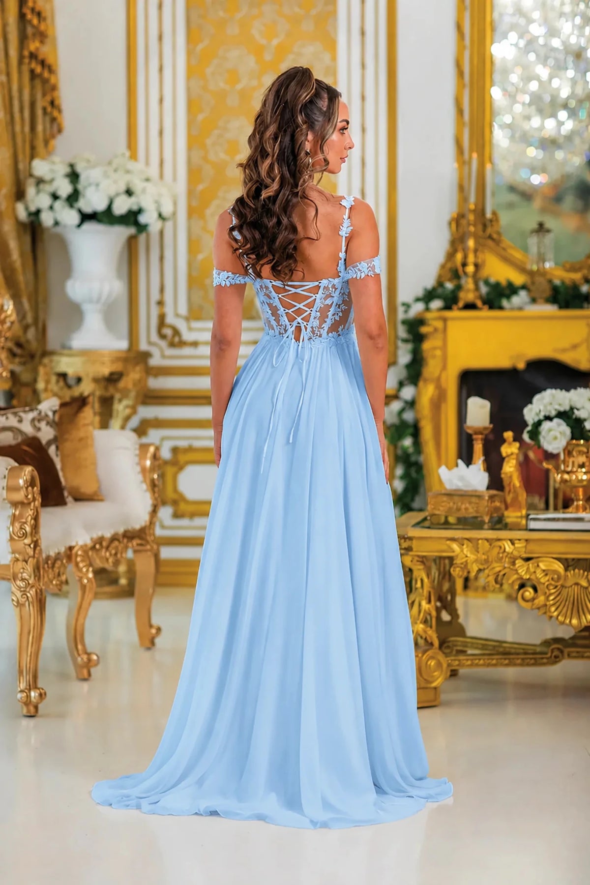 Lace-up back and flowing skirt complete the Bahama Blue Floral Applique Prom Dress.