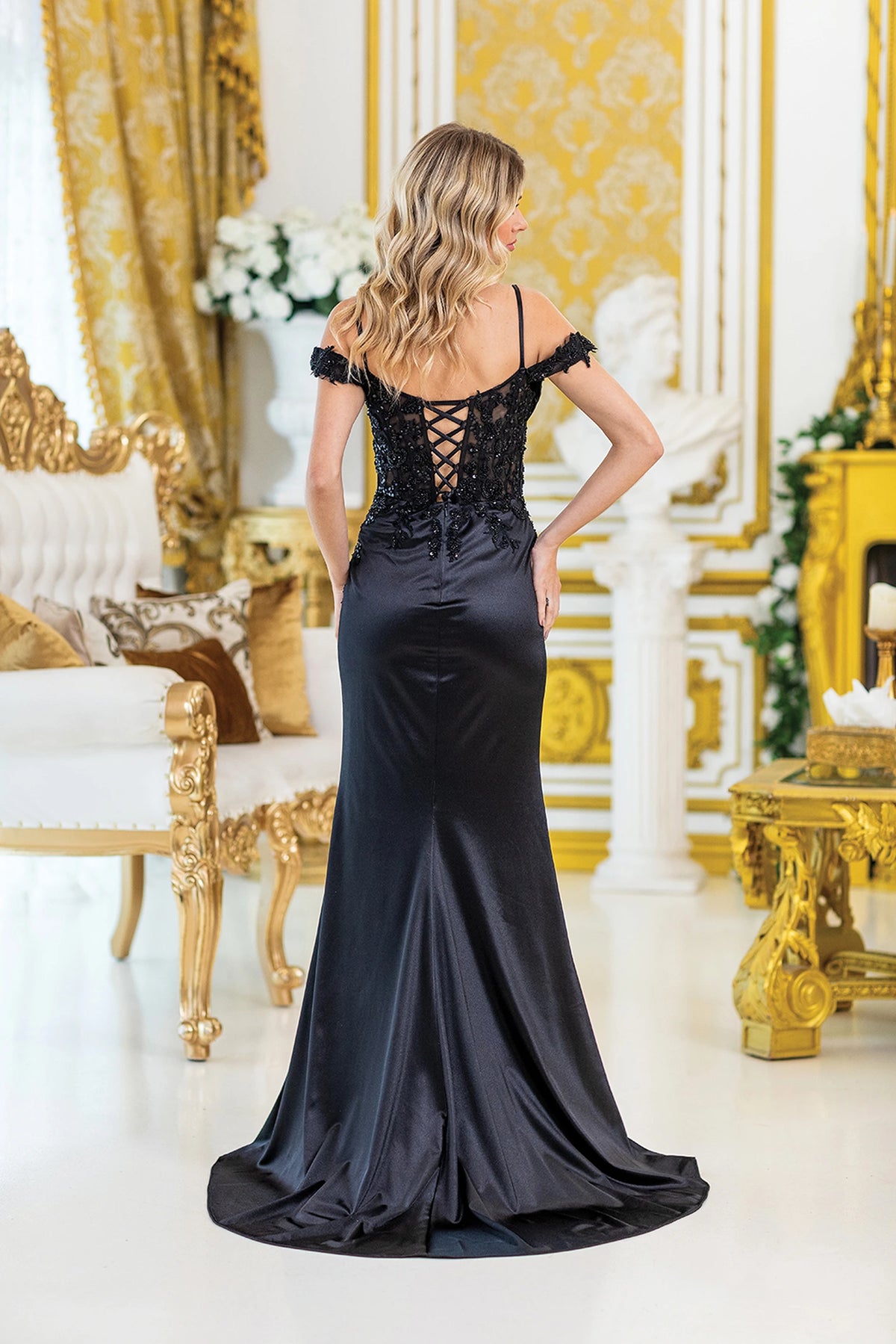 From the back, the Black prom dress reveals its floor-length skirt.