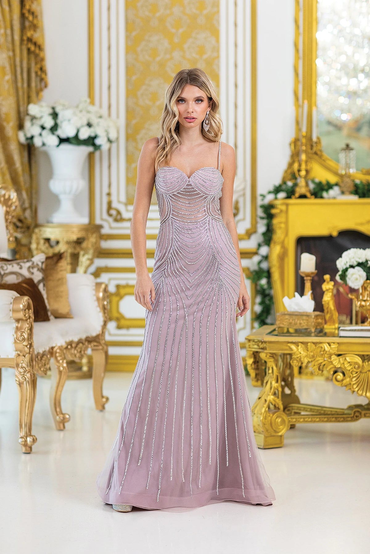 Featuring a floor-length skirt, this Mauve prom dress is shown in full view.