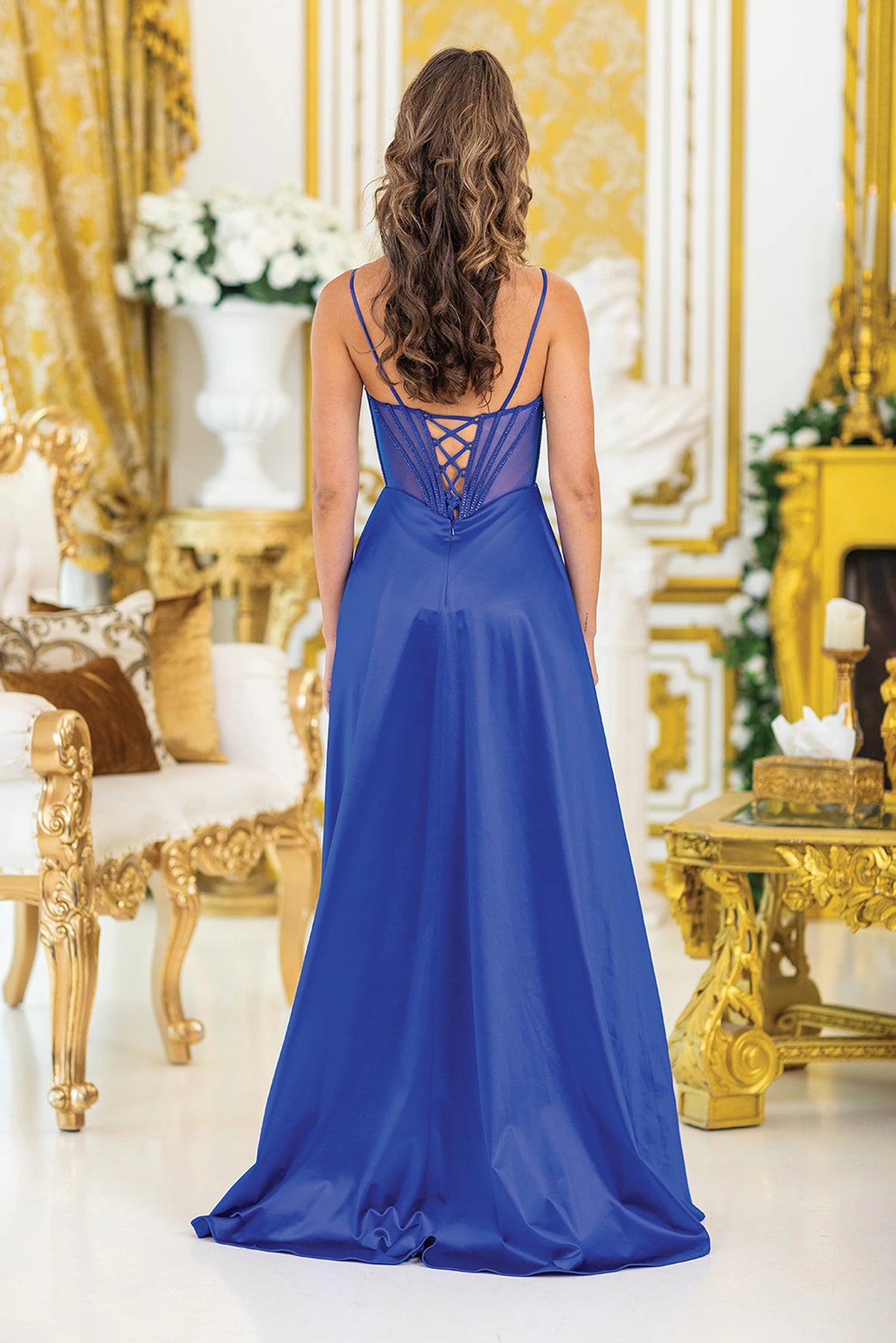 From the back, the Royal Blue prom dress reveals its floor-length skirt.