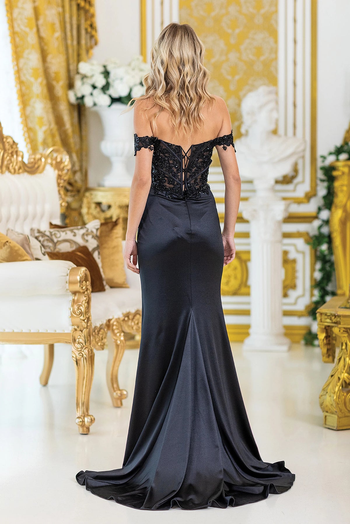 From the back, the Black prom dress reveals its floor-length skirt.