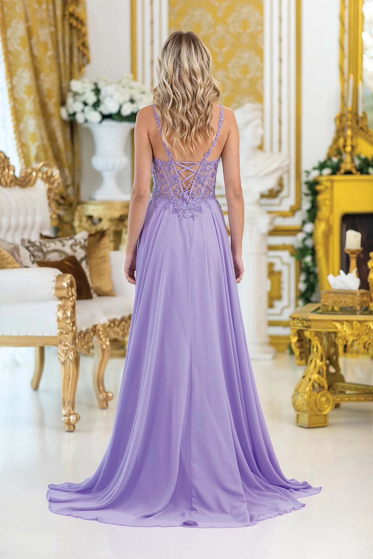 From the back, the Lilac prom dress reveals its floor-length skirt.