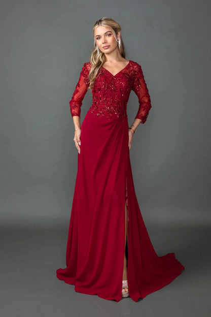 Woman in Burgundy chiffon prom dress with embroidered bodice and side slit.