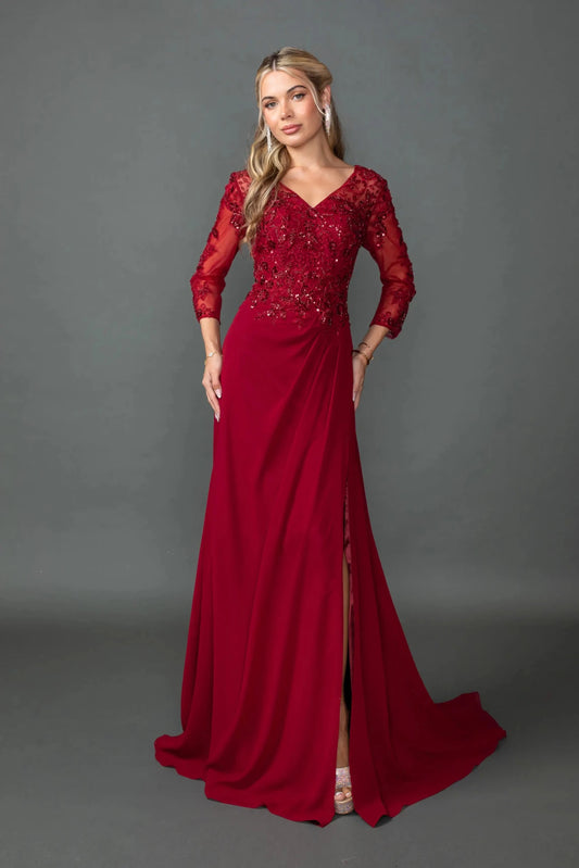 Woman in Burgundy chiffon prom dress with embroidered bodice and side slit.