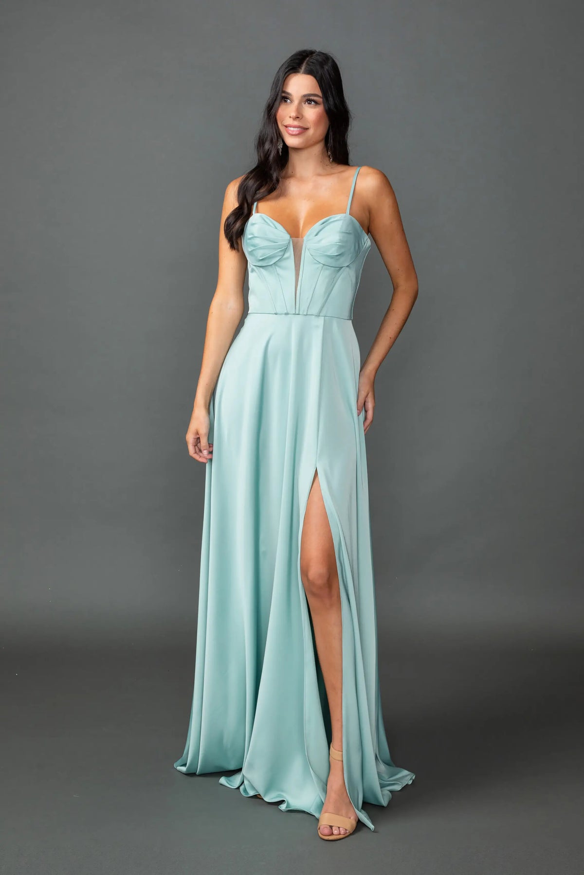 Showing a sweetheart bodice and high-slit satin skirt, this Sage prom dress is shown in full view.