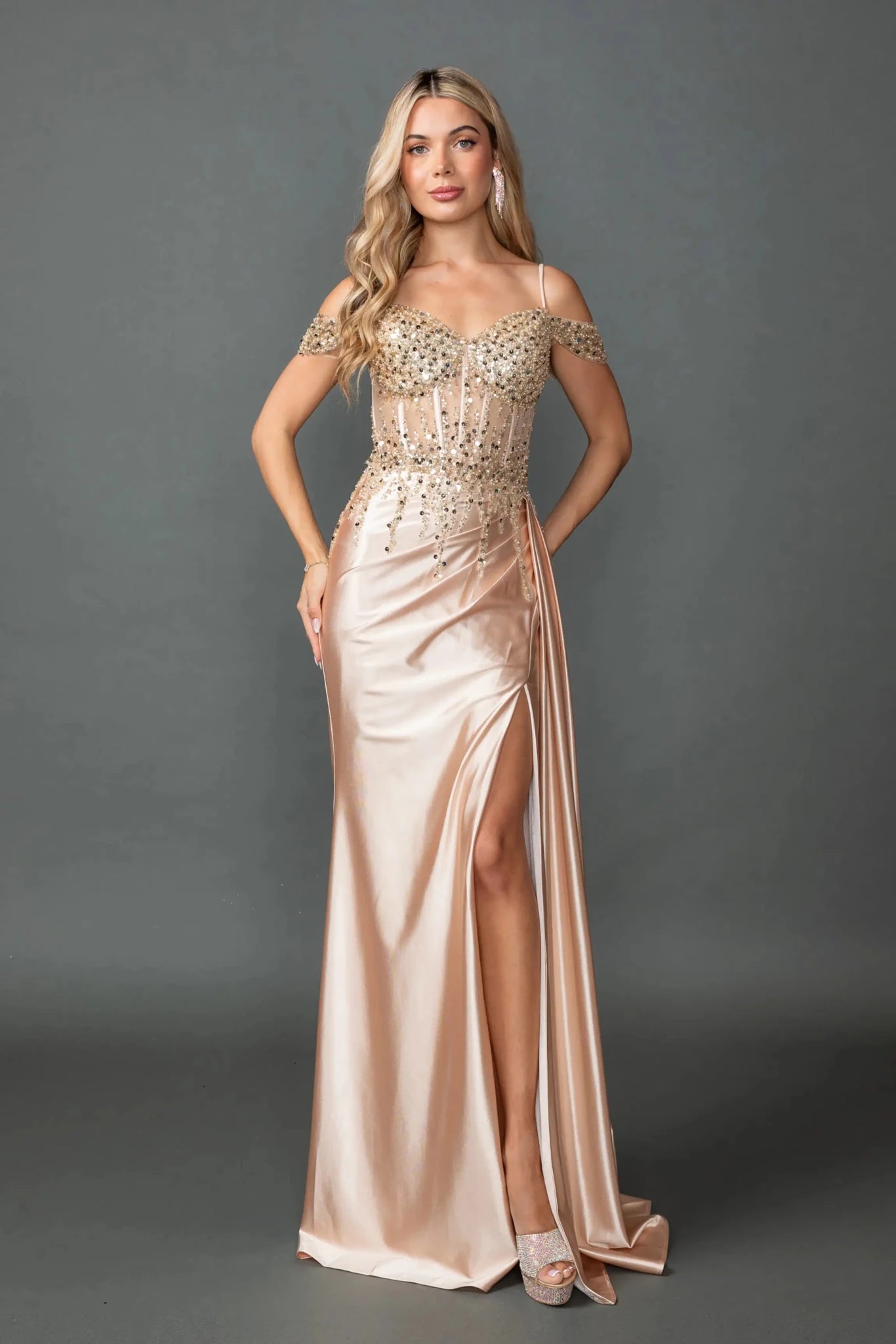 Gold off-shoulder prom dress with sequin corset and slit.