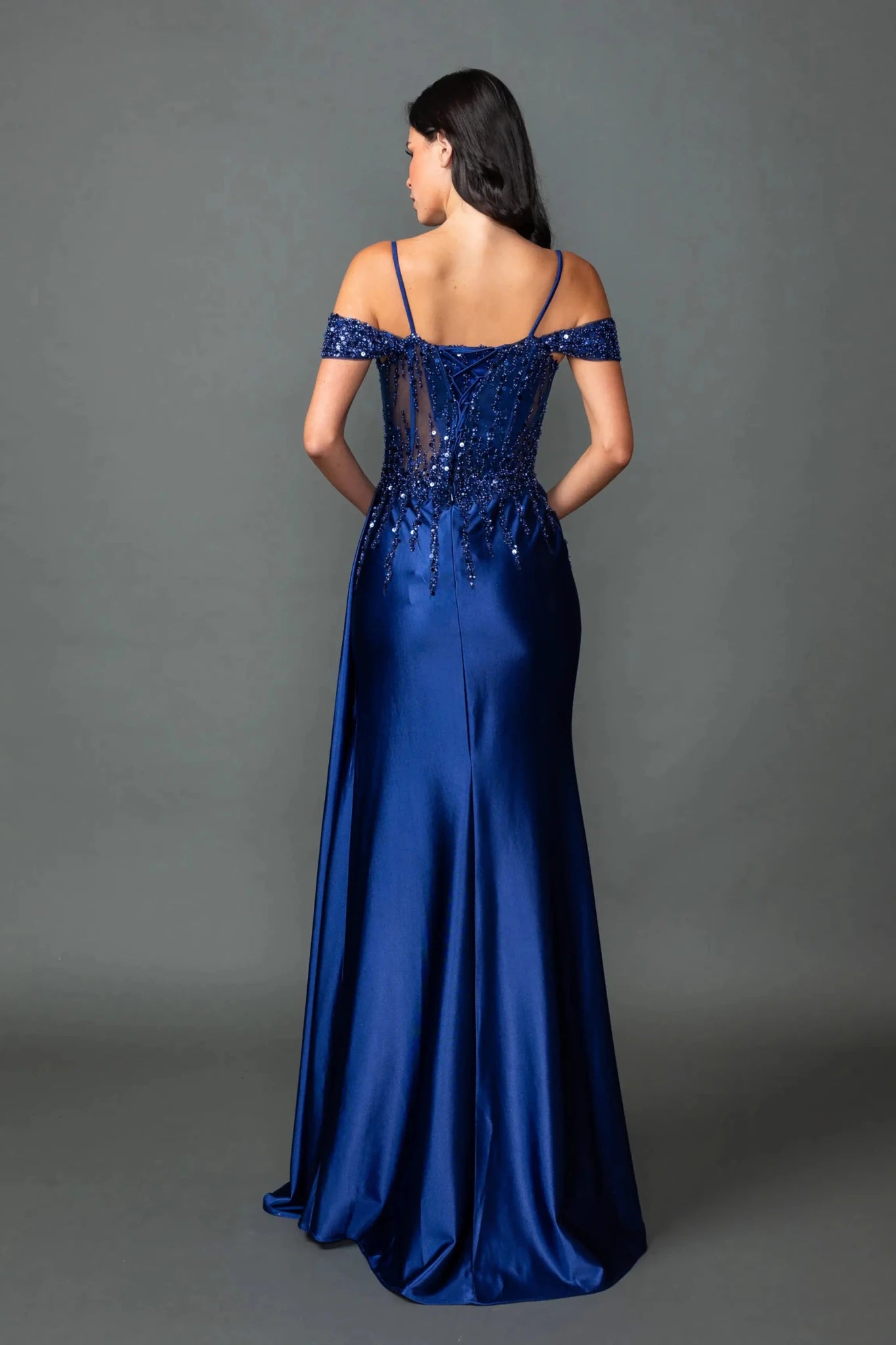 Navy prom dress embellished with sequins and beads with lace back  up