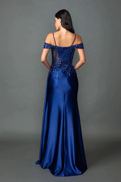 Rear view reveals navy prom dress embellished with sequins and beads with lace back up.