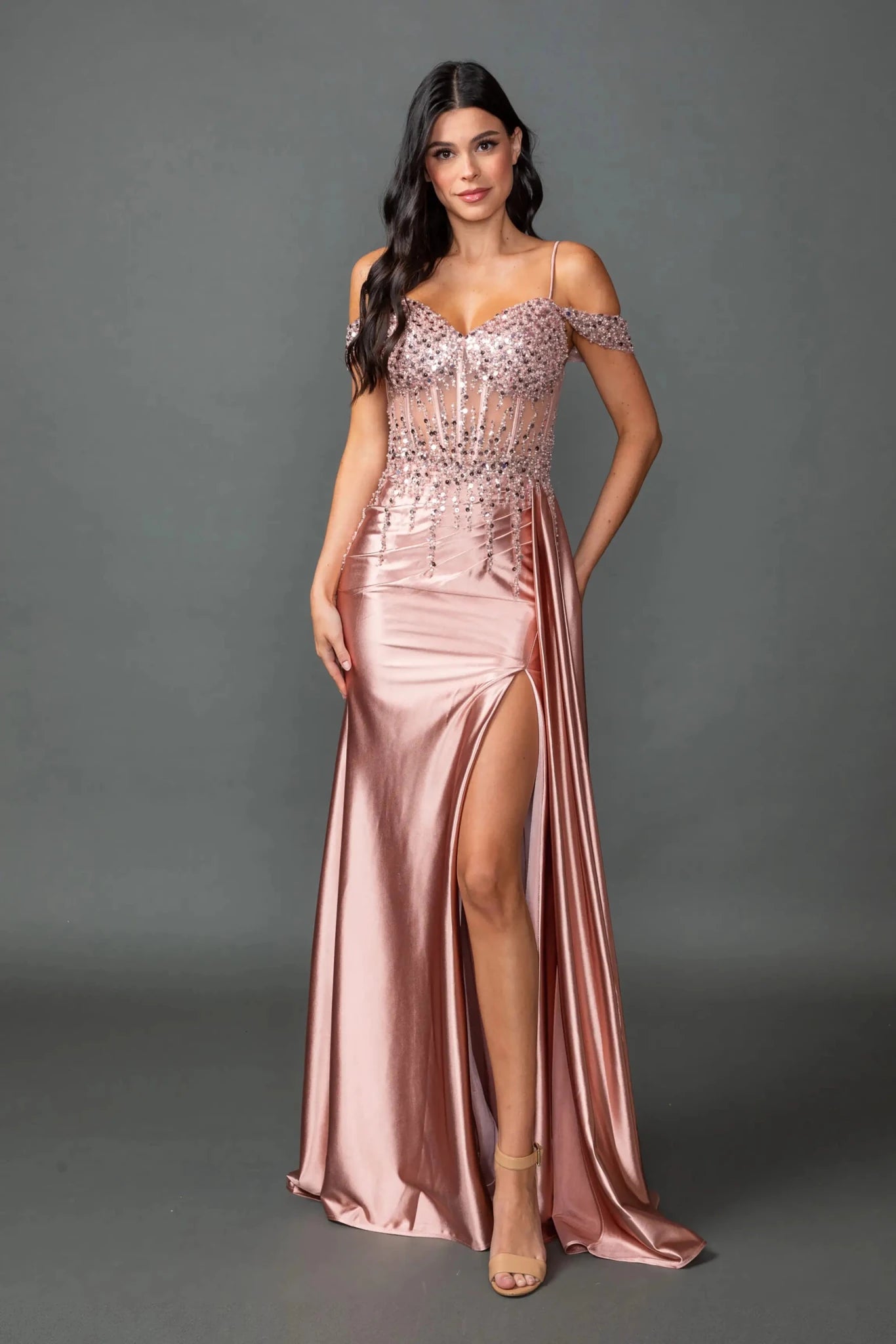 Rose gold off-shoulder prom dress with sequin corset and slit.