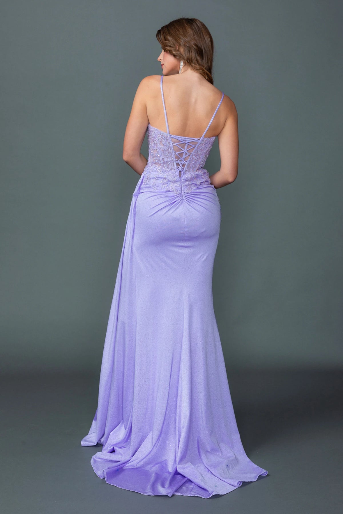 From the back, the Lilac prom dress reveals its floor-length skirt.