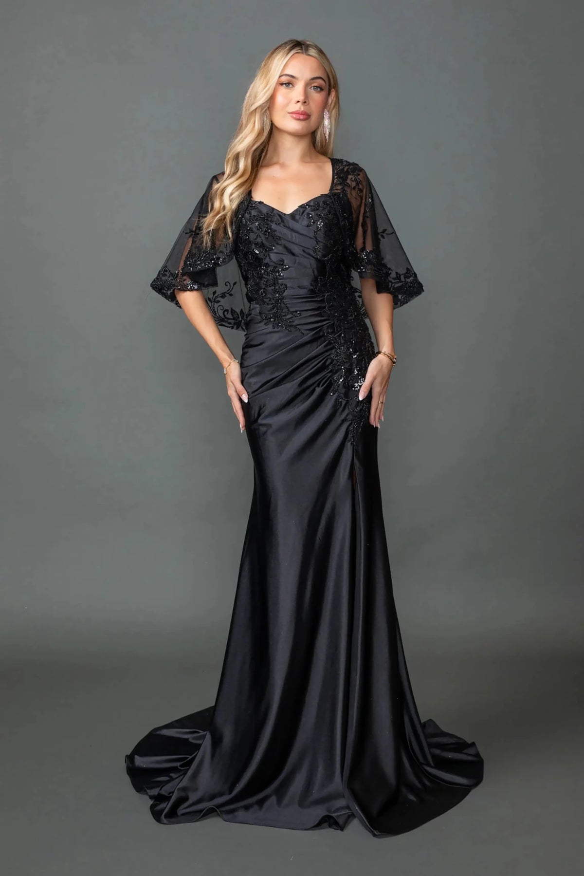 Black evening dress featuring fitted bodice with beaded lace embroidery and sequins