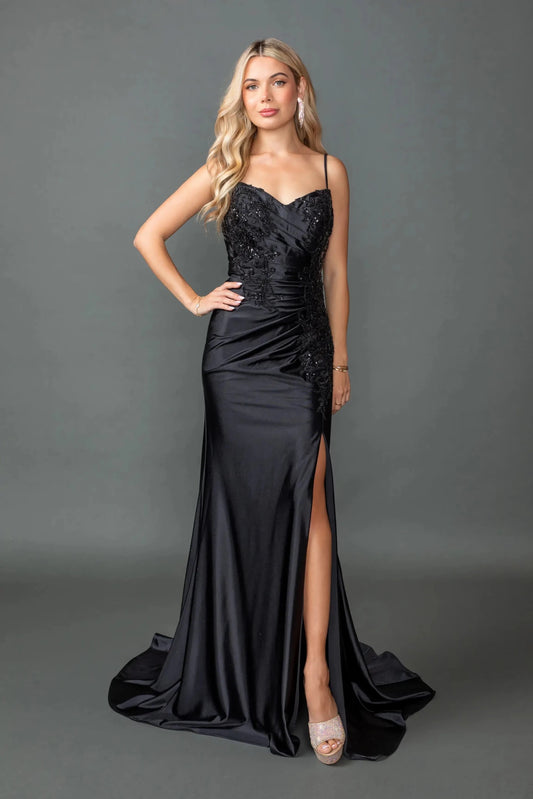 Woman in Black sweetheart prom dress with beaded lace bodice and slit skirt.